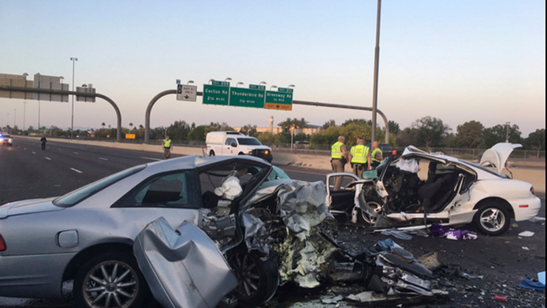 This photo provided by the Arizona Department of Public Safety shows the mangled remains of cars involved in a fatal accident on the Northbound Interstate 17 in Phoenix, Ariz. on Friday, April 14, 2017. Northbound Interstate 17 is closed following the wrong-way crash that authorities say involved two vehicles and killed three people. (Arizona Department of Public Safety via AP)