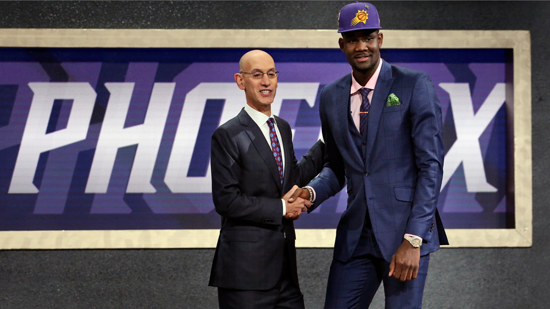 Arizona's Deandre Ayton, right, poses with NBA Commissioner Adam Silver after he was picked first overall by the Phoenix Suns during the NBA Draft at Barclays Center in Brooklyn, N.Y.