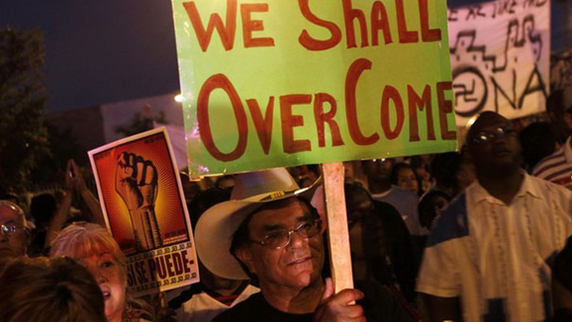 Demonstrators march to Arizona's State Capitol to protest the state's immigration law in Phoenix May 5. (Reuters Photo)