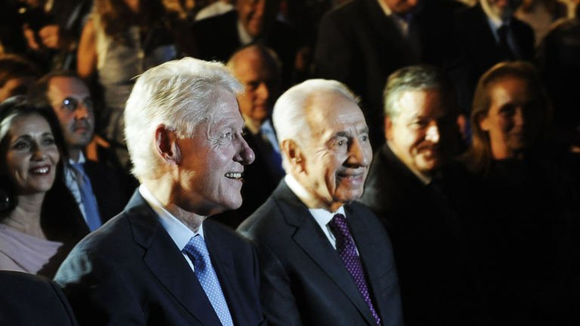Former US president Bill Clinton (L) and Israeli President Shimon Peres arrive on June 17, 2013 at the Peres Academic Center (EAC) in Rehovot. Clinton told the crowd at the event celebrating Peres' upcoming 90th birthday that he sees "no alternative" to a Palestinian state.
