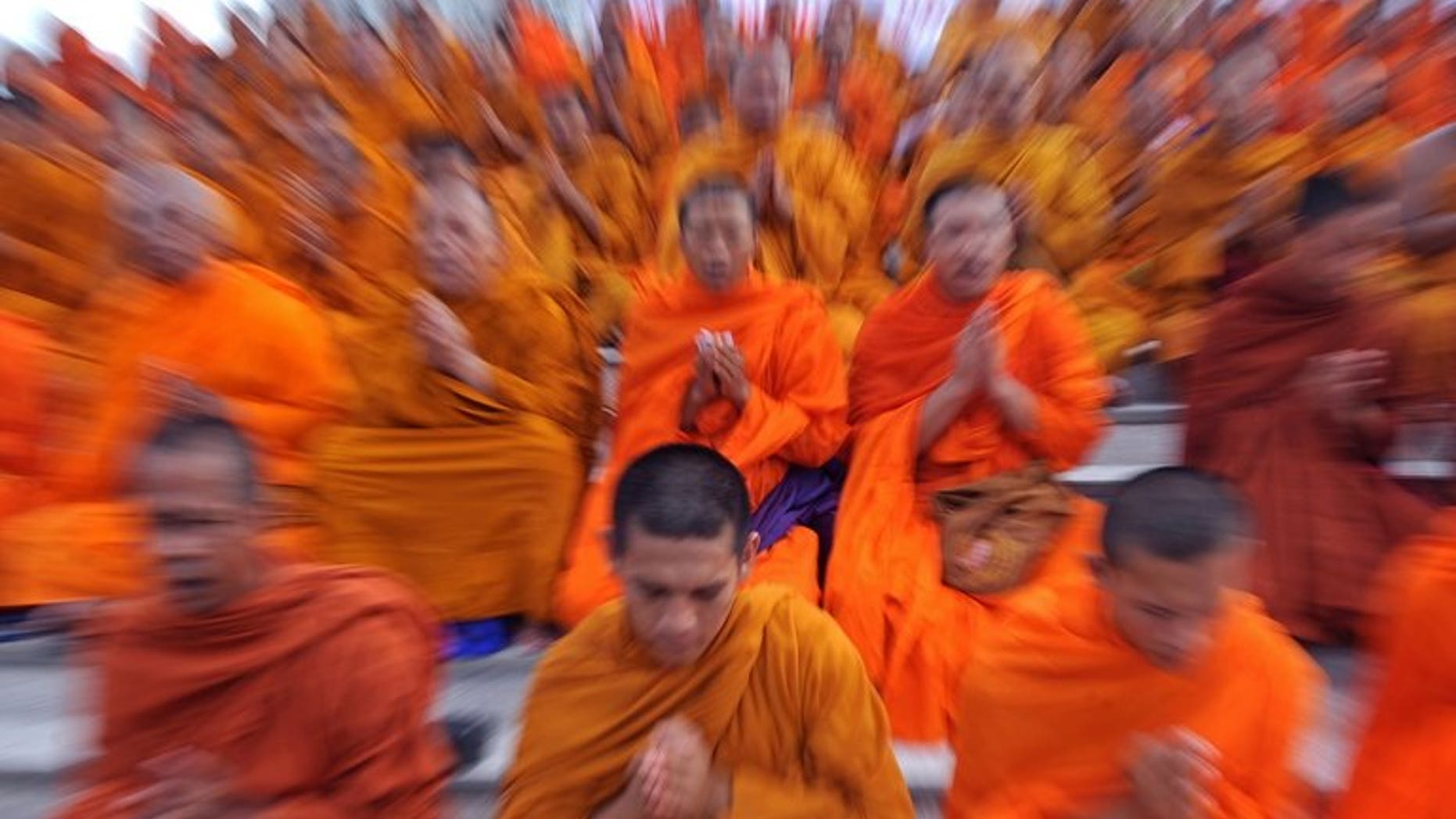 This file photo shows Buddhist monks praying in Bangkok, on May 16, 2010. The behaviour of Thailand's Buddhist clergy has been thrust under the spotlight after footage emerged of three monks flying in a private jet, wearing earphones and sunglasses and travelling with a Louis Vuitton luxury bag.