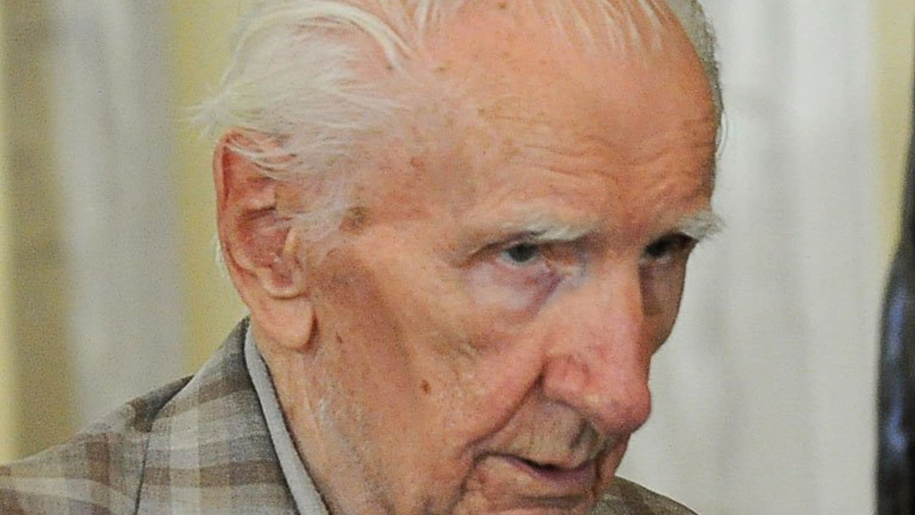 File picture shows top Nazi war crimes suspect Laszlo Csatari, aka Laszlo Csizsik-Csatari, leaving a courthouse in Budapest on July 18, 2012. Csatari, accused of overseeing thousands of Jewish deportations during World War II, was charged with war crimes on Tuesday in Hungary, prosecutors said.
