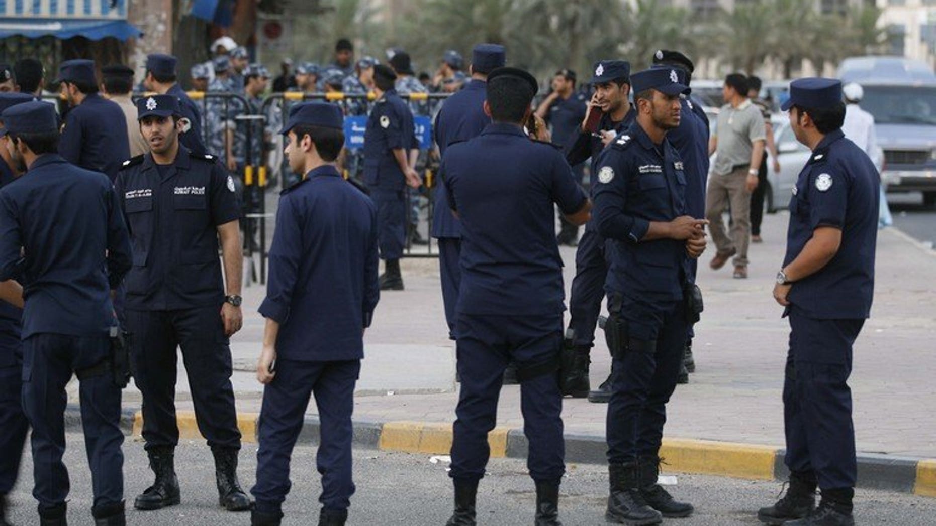 Kuwaiti police stand guard in Kuwait City on May 27, 2011. Authorities in Kuwait hanged a 33-year-old Egyptian man dubbed a "monster" for the abduction and rape of 17 children under the age of 10,