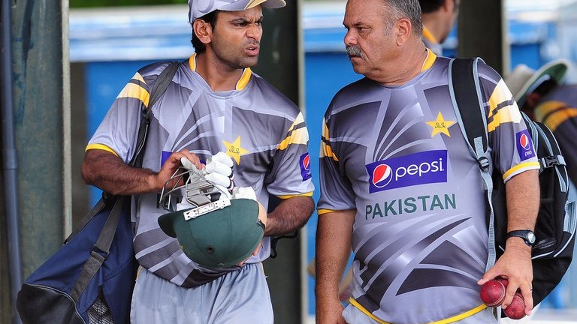 Pakistan coach Dav Whatmore (right) gives instructions to player Mohammad Hafeez during a practice session in Colombo on June 28, 2012. Whatmore said the team would be reviewed with an eye on building for the 2015 World Cup after their dismal showing at the Champions Trophy in England