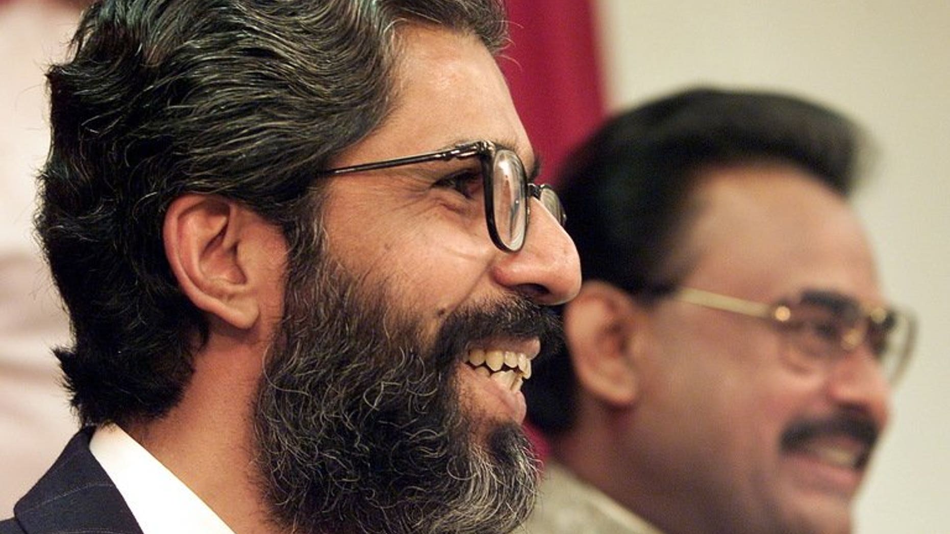 Pakistani Muttahida Quami Movement (MQM) secretary general Imran Farooq (left) gives a press conference in London on September 9, 1999. British counter-terror police on Tuesday searched two residential properties in London as part of an investigation into the murder of Pakistani politician Imran Farooq almost three years ago.