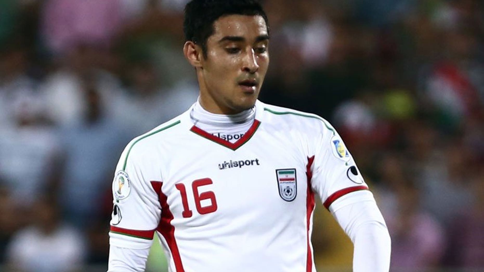 Iranian forward Reza Ghoochannejhad plays during a 2014 World Cup Asian zone match at Azadi Stadium in Tehran on June 11, 2013. Iran beat South Korea 1-0 to reach the 2014 World Cup but the hosts also qualified on goal difference despite a heroic effort by group rivals Uzbekistan.
