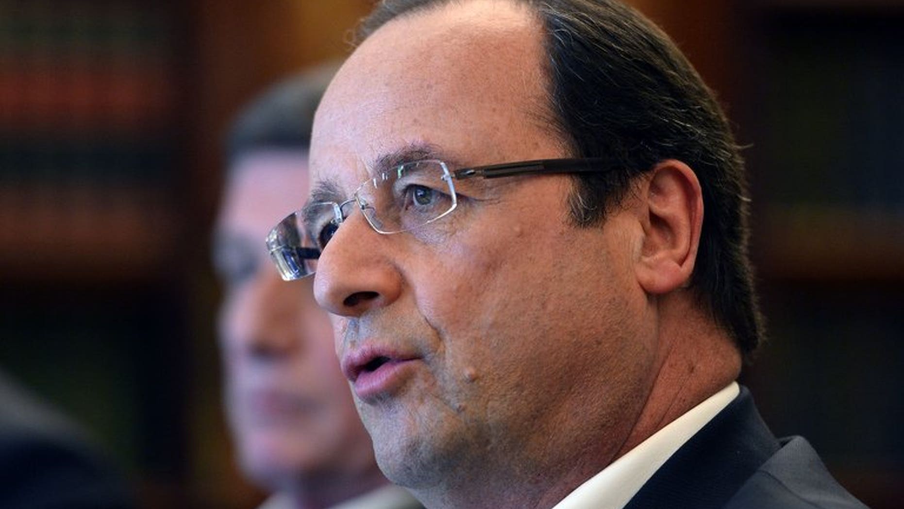 French President Francois Hollande speaks during a bilateral meeting on the sidelines of the G8 summit near Enniskillen, Northern Ireland on June 18, 2013. Hollande said Tuesday that Iranian president-elect Hassan Rowhani would be welcome at Syria peace talks "if he can be useful".