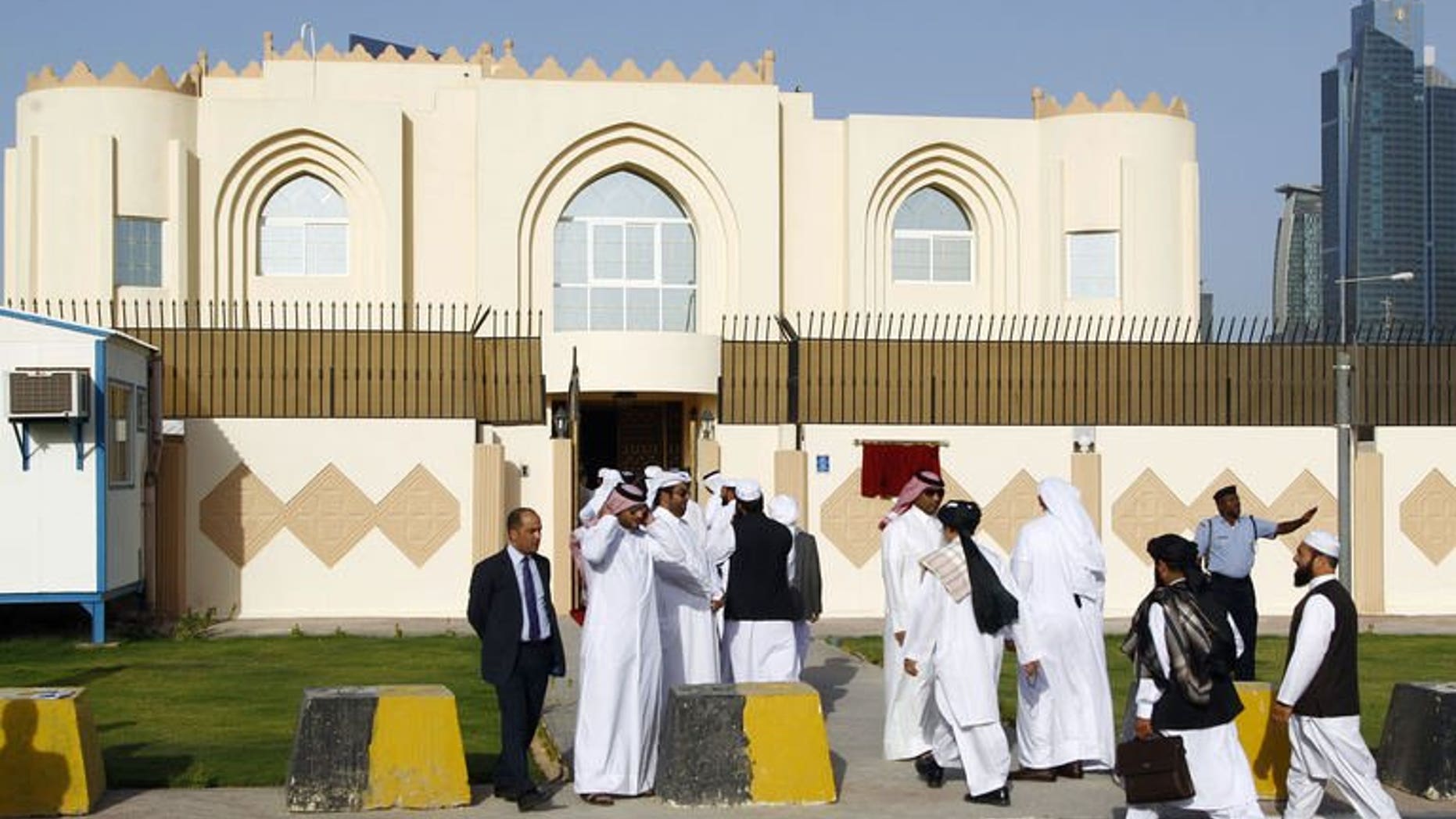 Guests arrive for the opening ceremony of the new Taliban political office in Doha on June 18, 2013. British Prime Minister David Cameron said the United States was doing the right thing by meeting with Taliban representatives after the Afghan militants opened an office in Qatar.
