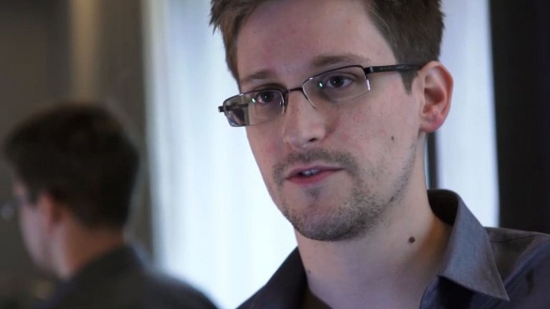 This still frame grab released to AFP on June 10, 2013 shows Edward Snowden speaking during an interview with The Guardian newspaper at an undisclosed location in Hong Kong. Iceland said Wednesday it has held informal talks with an intermediary of US intelligence leaker Snowden who reportedly may want to seek political asylum there.