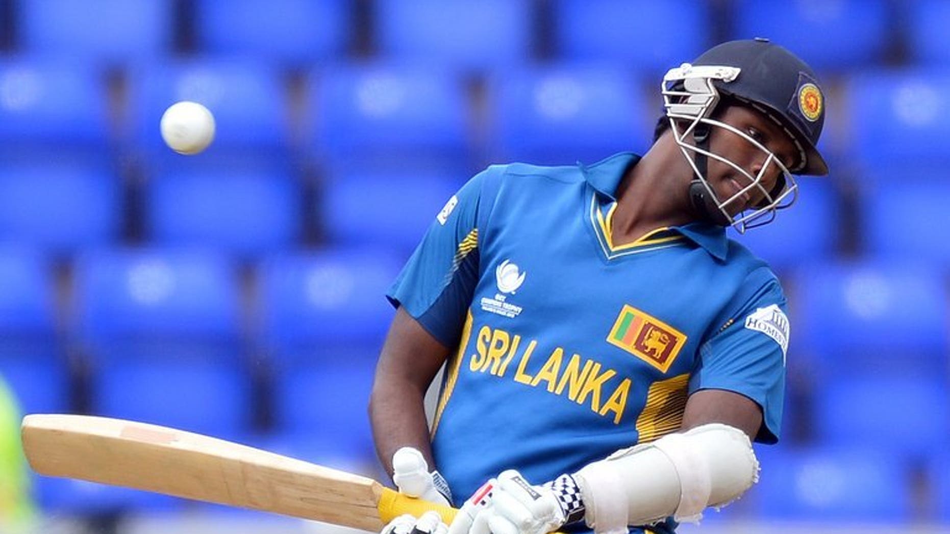 Sri Lanka's Angelo Mathews avoids a ball during the 2013 ICC Champions Trophy cricket match between Sri Lanka and New Zealand at The Cardiff Wales Stadium in Cardiff, Wales, on June 9, 2013. Mathews on Wednesday vowed that his "fighting team" were prepared to put recent history behind them when they face India in the semi-finals of the Champions Trophy.