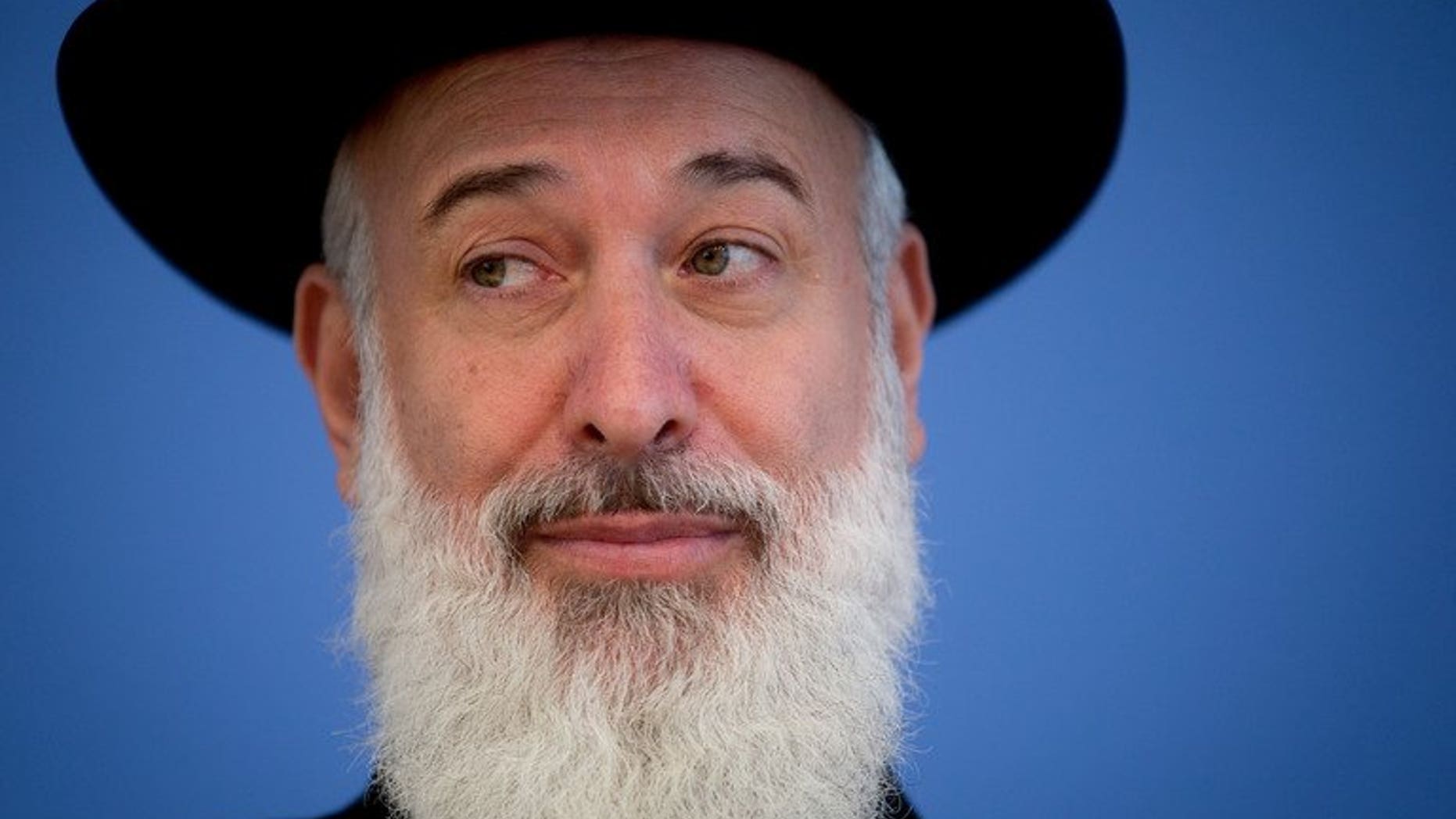 Israeli Chief Ashkenazi Rabbi Yona Metzger speaks, seen on August 21, 2012 in Berlin, Germany. Israel's chief Ashkenazi rabbi has been put under house arrest after a marathon grilling by detectives on suspicion of bribery, theft and breach of trust.
