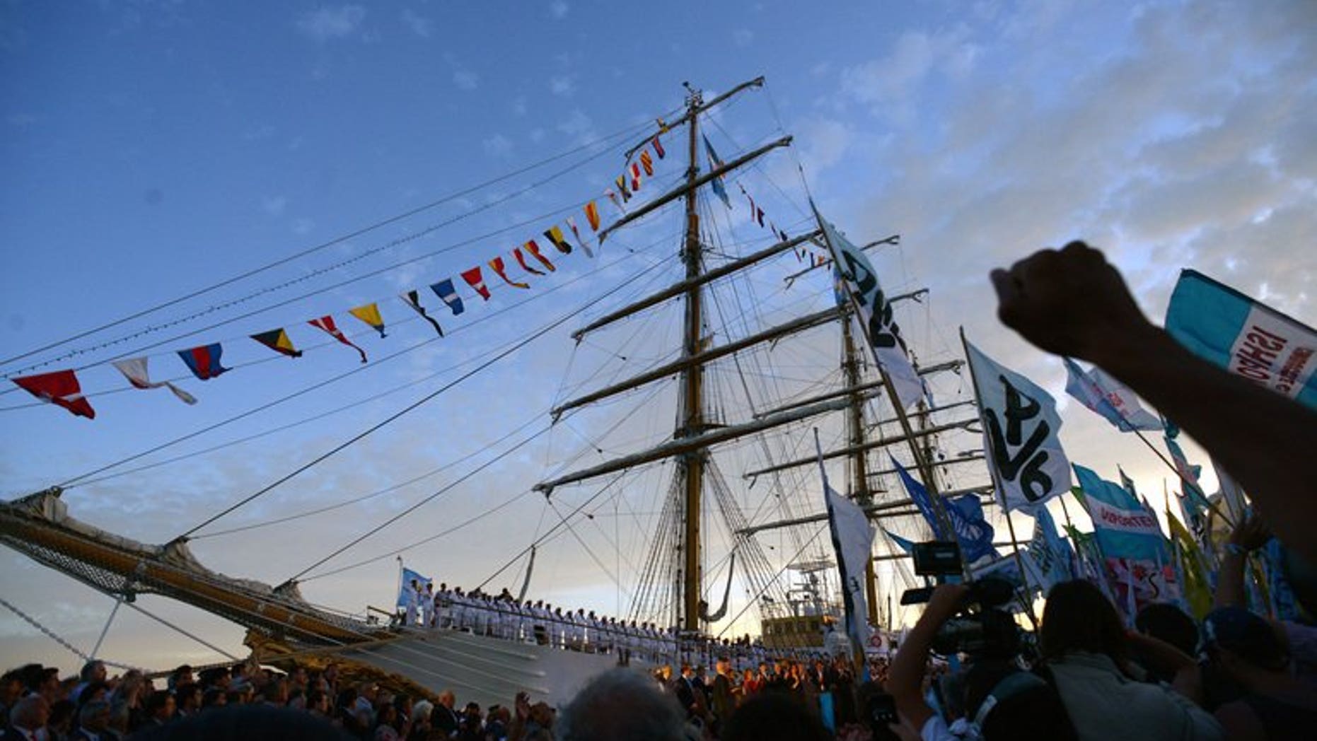 Argentine government supporters attend the arrival of Argentina's frigate Libertad in Mar del Plata, 400km south of Buenos Aires, Argentina on January 9, 2013. Ghana's supreme court has ruled that the seizure of an Argentinian warship that led to a weeks-long ordeal last year was "fundamentally and patently wrong," a copy of the decision said Friday.