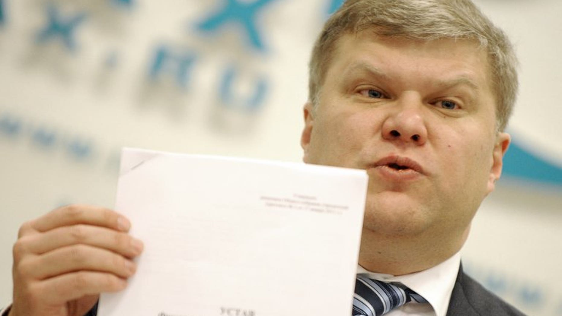 The Yabloko opposition party leader Sergei Mitrokhin speaks during a press conference in Moscow, on January 16, 2012. The head of a top Russian rights group and Mitrokhin say they been assaulted by riot police during a night-time raid on the non-profit group in the latest crackdown on activists during Vladimir Putin's new term.