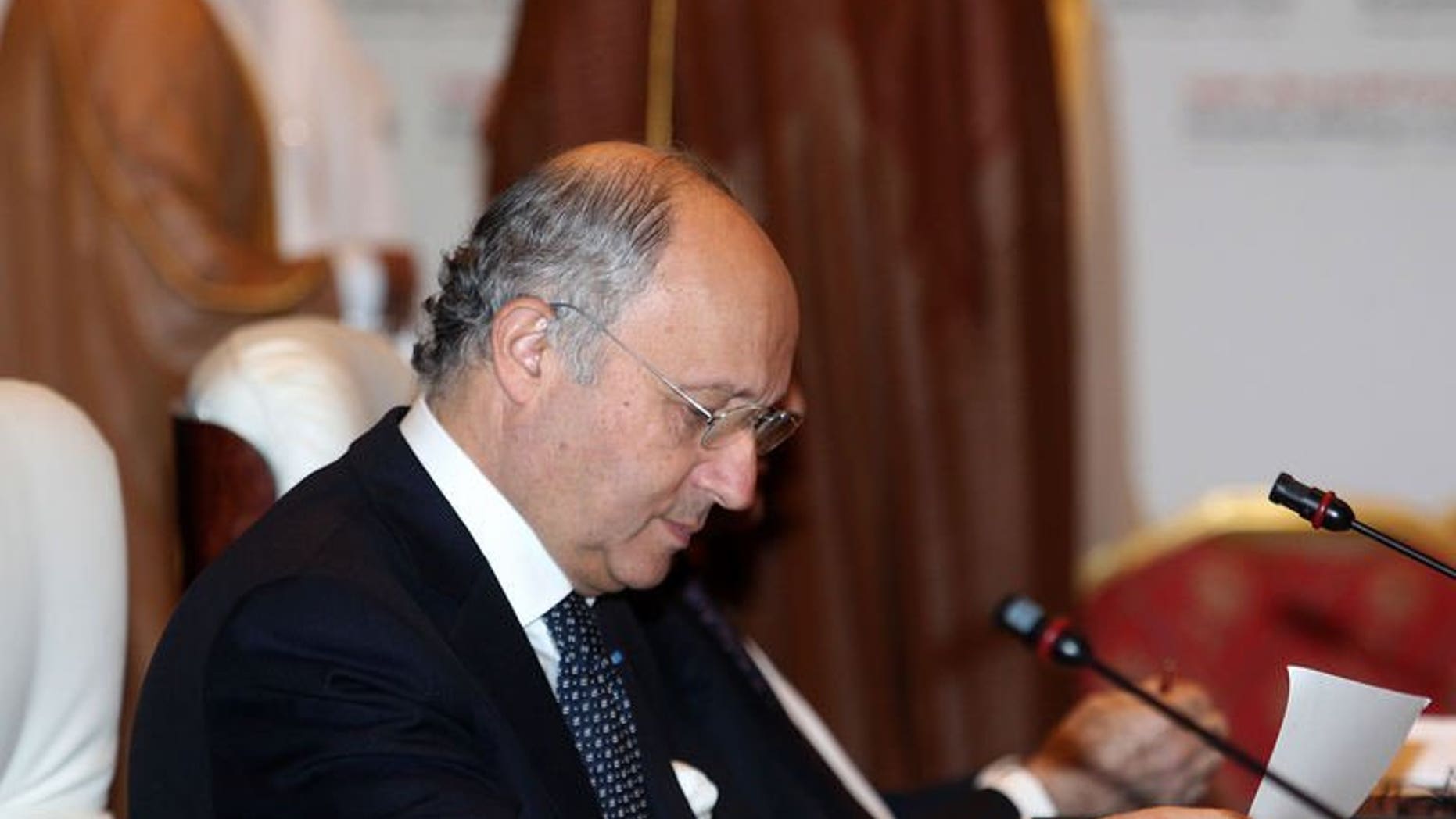 French Foreign Minister Laurent Fabius attends the "Friends of Syria" meeting in the Qatari capital Doha, on June 22, 2013. Foreign ministers of governments that support the Syrian opposition gathered in Qatar after rebels welcomed recent arms deliveries they said could turn the tables on the Damascus regime. AFP PHOTO/FAISAL AL-TIMIMI