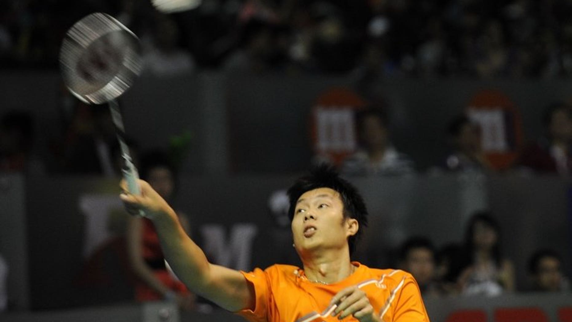 Thailand's Boonsak Ponsana hits a return against Japan's Ueda Takuma during their men's singles semi-final badminton match at the Singapore Open on June 22, 2013. Boonsak won 21-8, 21-15.