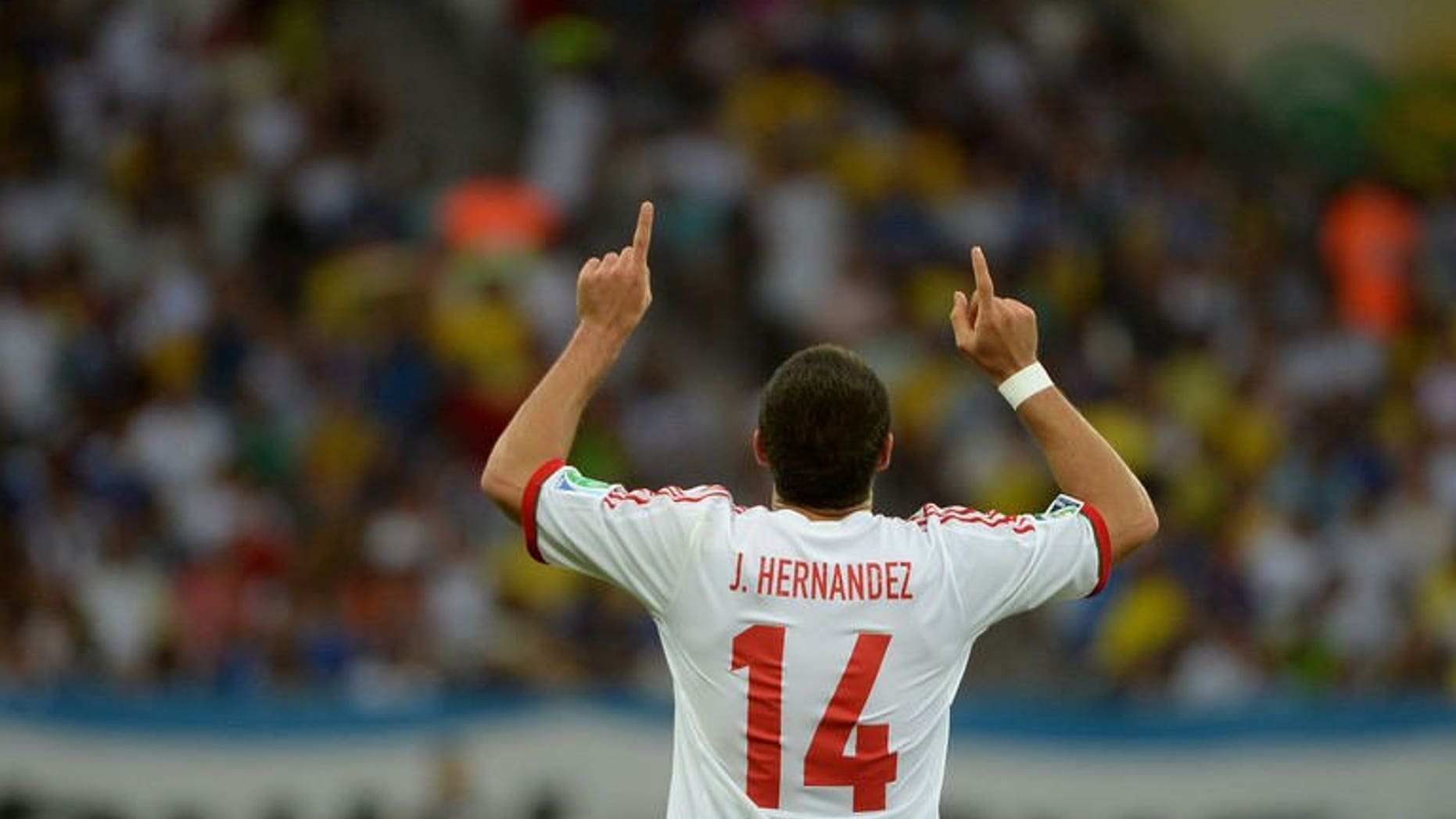 Mexico's forward Javier Hernandez celebrates after scoring against Japan during their FIFA Confederations Cup Group A football match, at the Mineirao Stadium in Belo Horizonte on June 22, 2013. Javier Hernandez scored twice but missed a last-minute penalty as Mexico defeated Japan 2-1 on Saturday to leave the Asian side winless at the Confederations Cup.