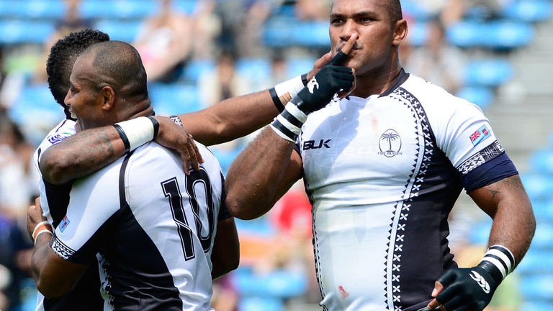 Nemani Nadolo (R) of Fiji reacts with joy after his try against Tonga in the Pacific Nations Cup in Tokyo on June 23, 2013. Fiji won the Cup for the first time with a 34-21 victory on the final day of the five-team tournament.