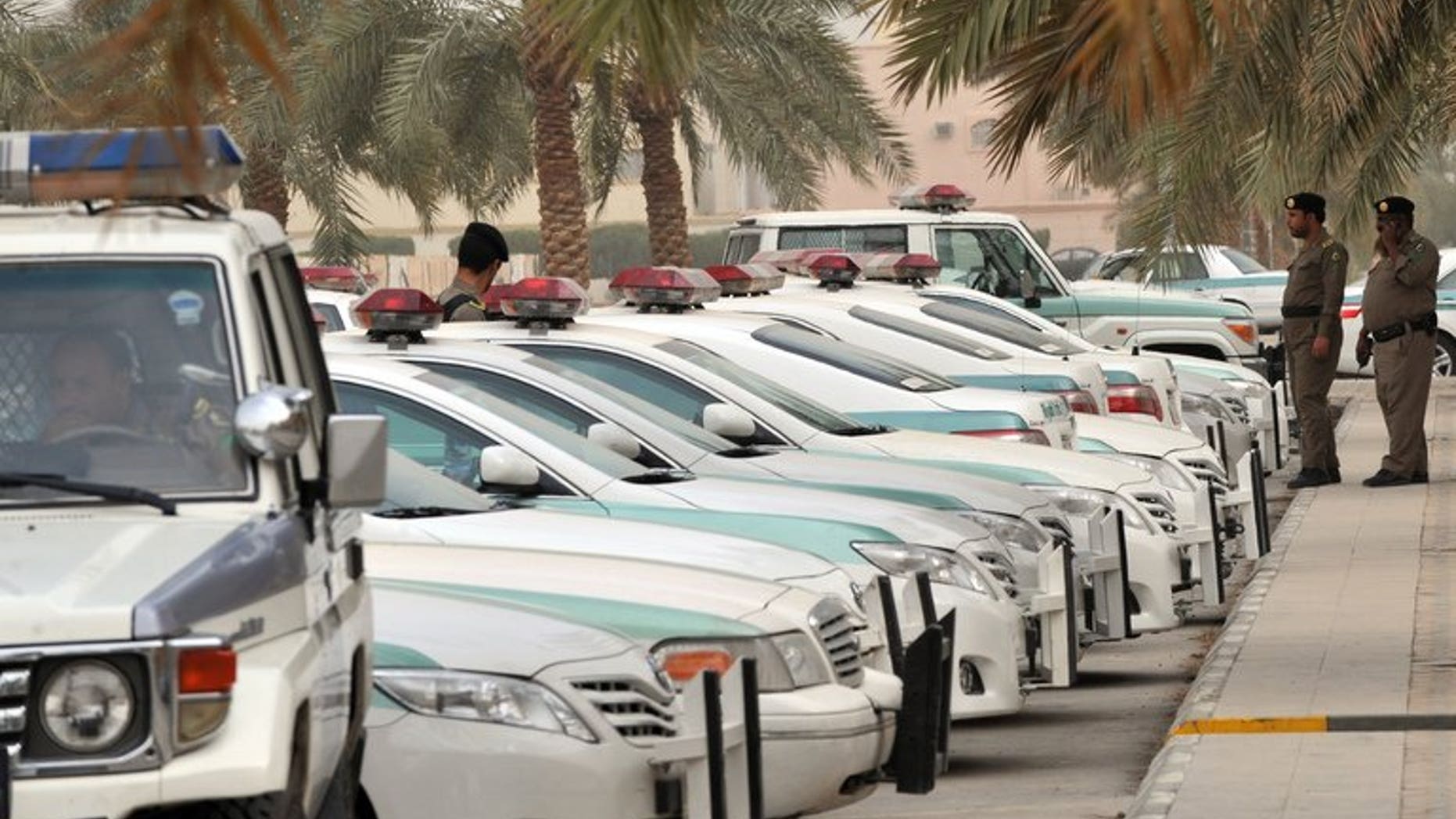 Saudi police cars are parked outside the Al-rajhi mosque in Riyadh, on March 11, 2011. Saudi police have killed a man who fled when they tried to arrest him for allegedly taking part in unrest that shook the kingdom's Shiite-populated Eastern Province last year, according to the official SPA news agency.