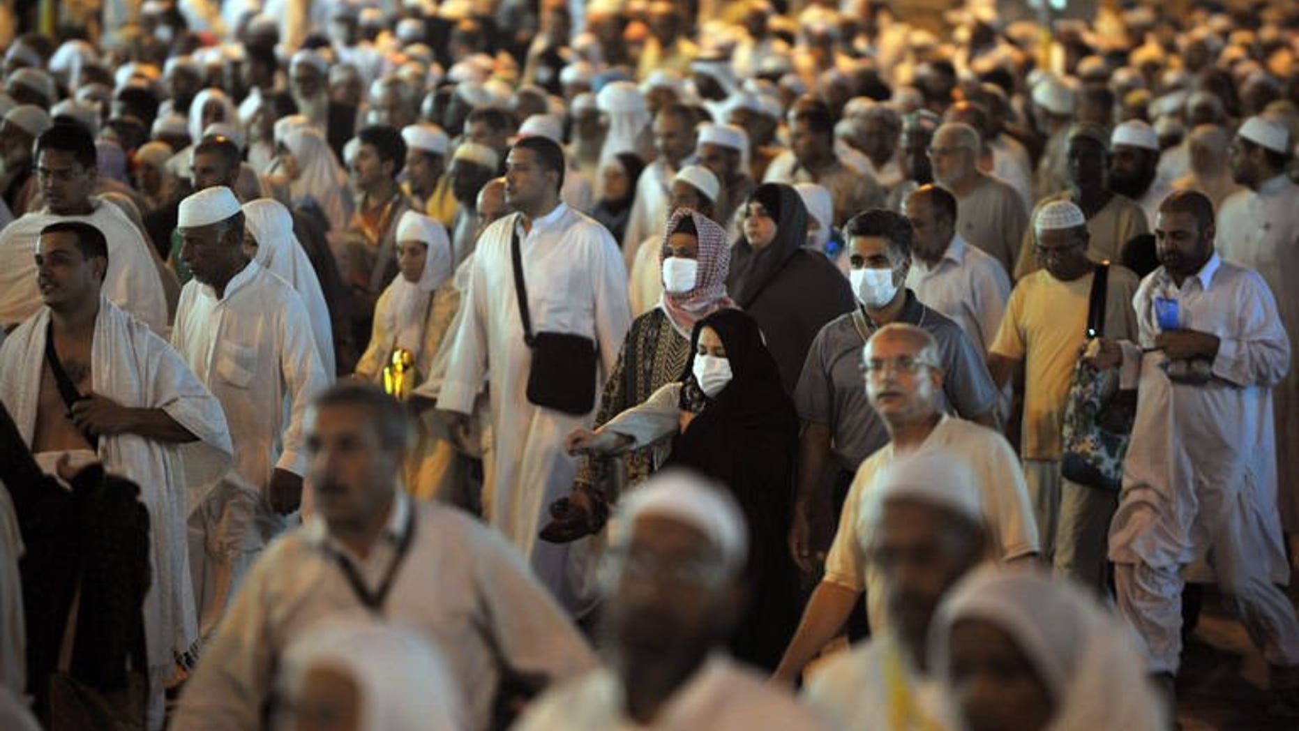 Tens of thousands of Muslim piligrims leave Mecca's Grand Mosque after the evening prayer on November 2, 2011. Twelve Sudanese were killed when a wall collapsed as they waited to submit their applications for the annual hajj pilgrimage, official TV said.