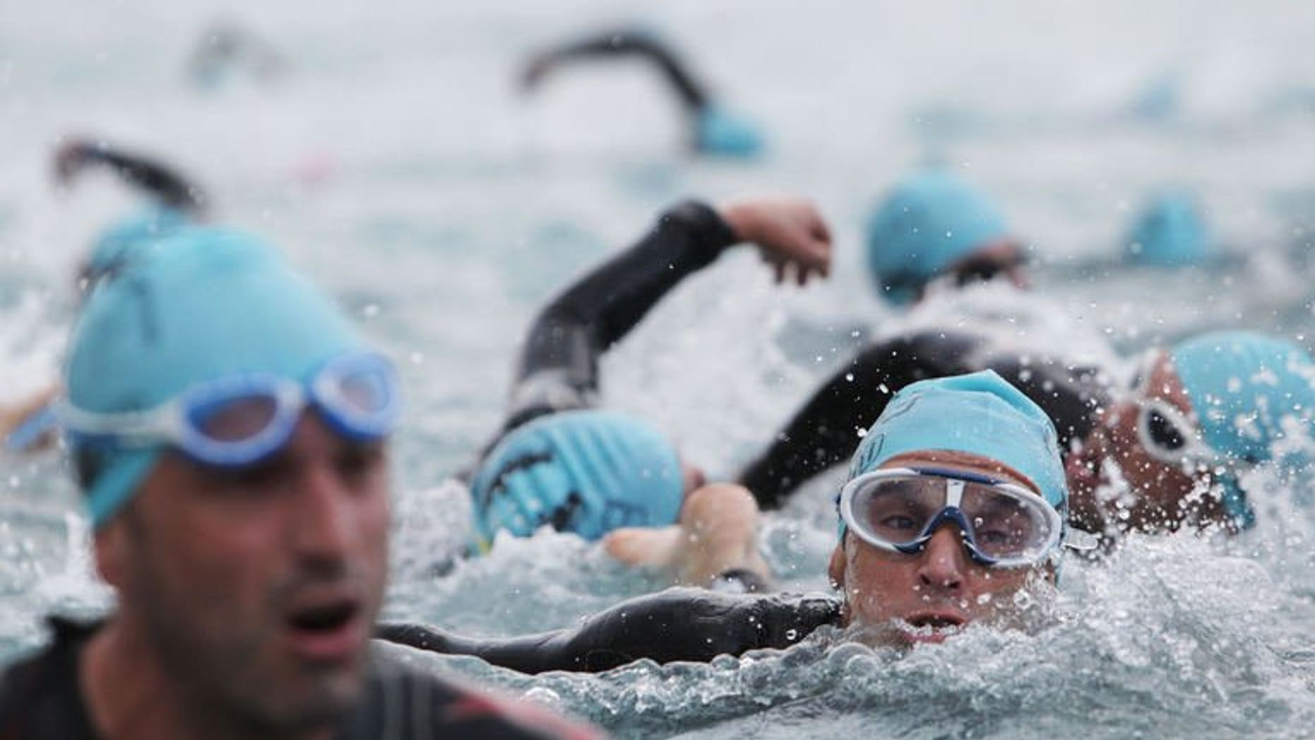 Triathletes swim during the Ironman race in Nice southeastern France on June 22, 2013. A 30-year-old Briton has died after crashing in the cycling section of the event on the French Riviera, emergency services said.
