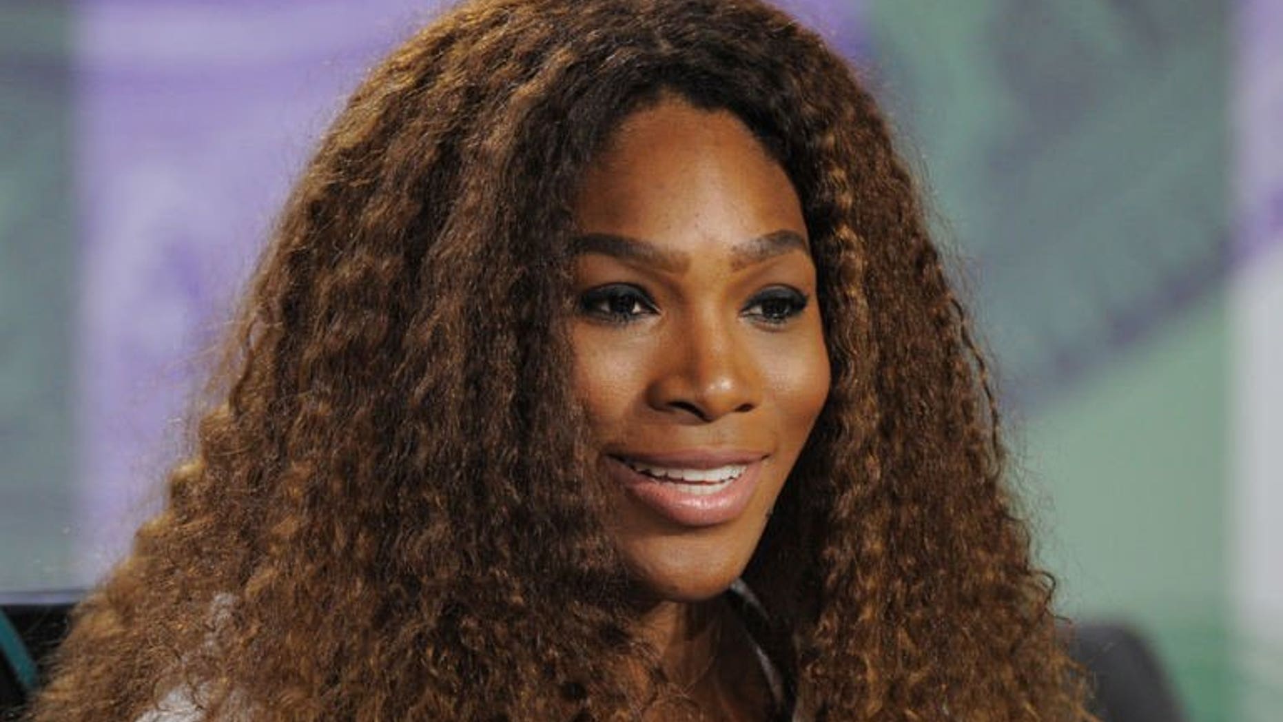 US tennis player Serena Williams attends a news conference at the All England Tennis Club in Wimbledon, London, on June 23, 2013. Williams tried to defuse her war of words with Maria Sharapova as the Wimbledon champion claimed she had apologised to the Russian for criticising her private life.
