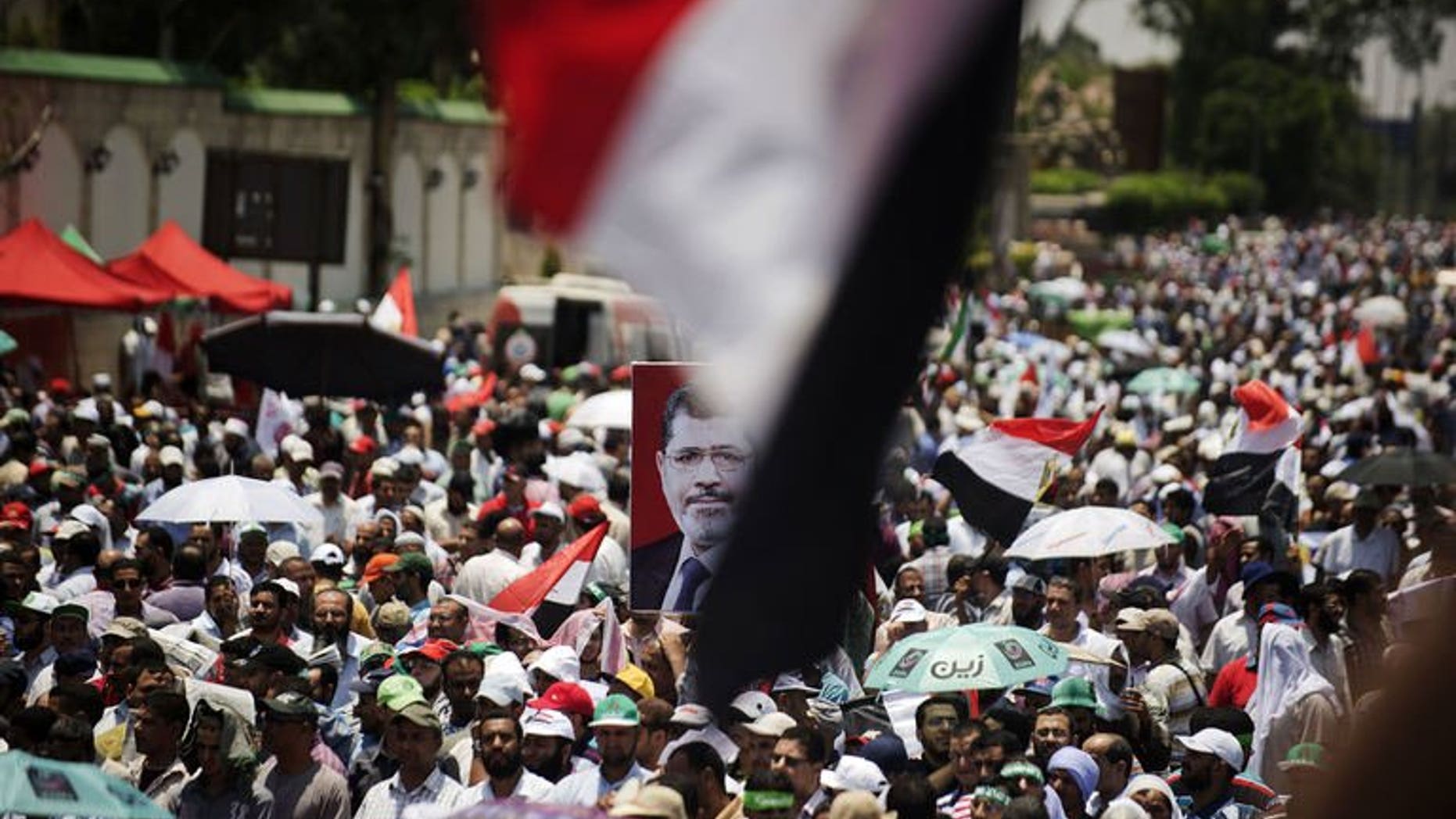 Egyptian Islamist groups take part in a demonstration to mark the upcoming one year anniversary since President Mohamed Morsi was elected, on June 21, 2013 in Cairo. Egypt's defence minister has warned the army will intervene if violence breaks out in the country where opponents of Morsi are planning rallies against him this month.