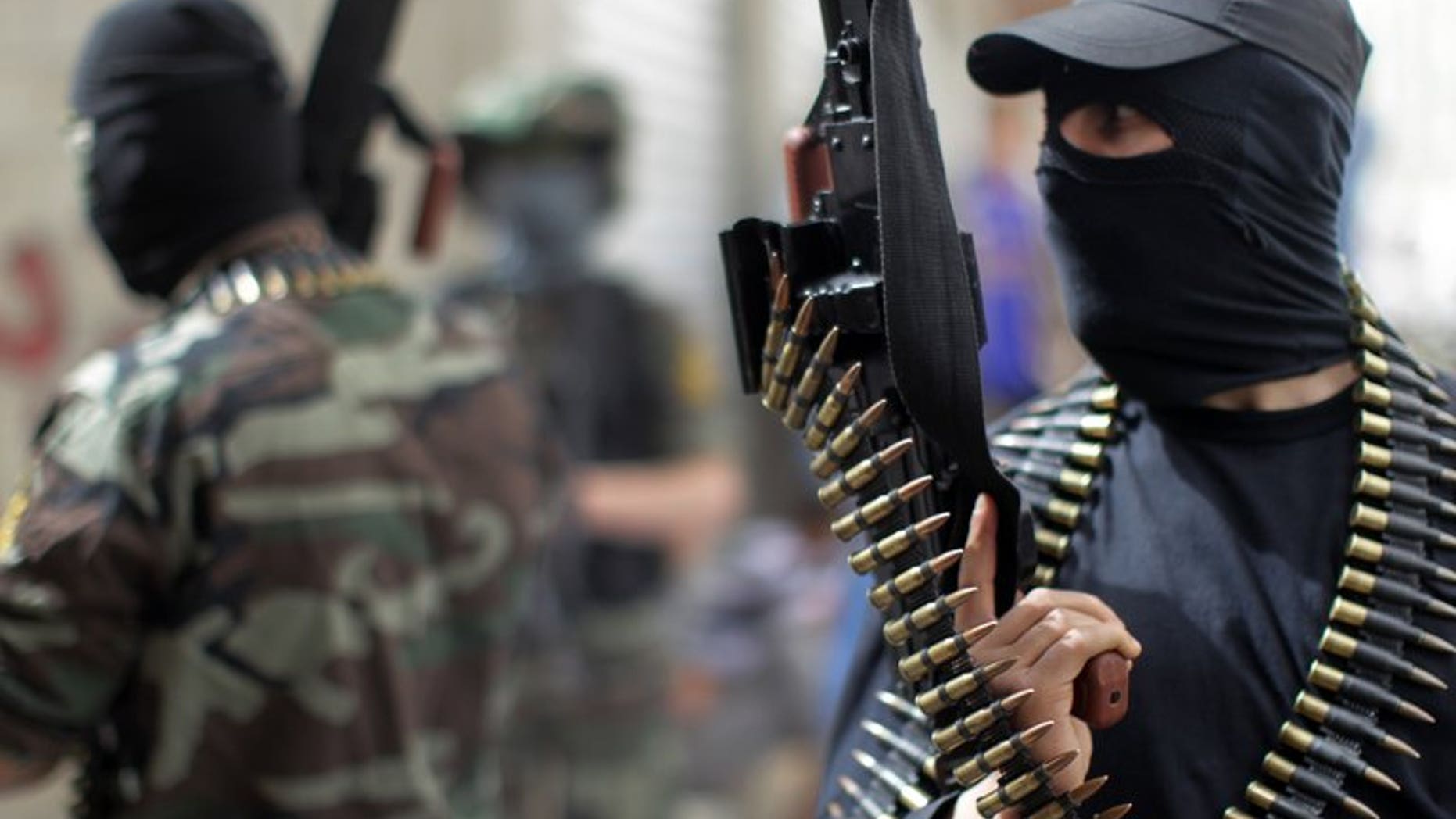 Palestinian militants from the Islamic Jihad group in Jabalia in the northern Gaza Strip on April 8, 2013. Islamic Jihad severed contacts with the Hamas rulers of Gaza Sunday after a commander in its military wing died of wounds sustained in a police shooting, a leader of the radical group told AFP.