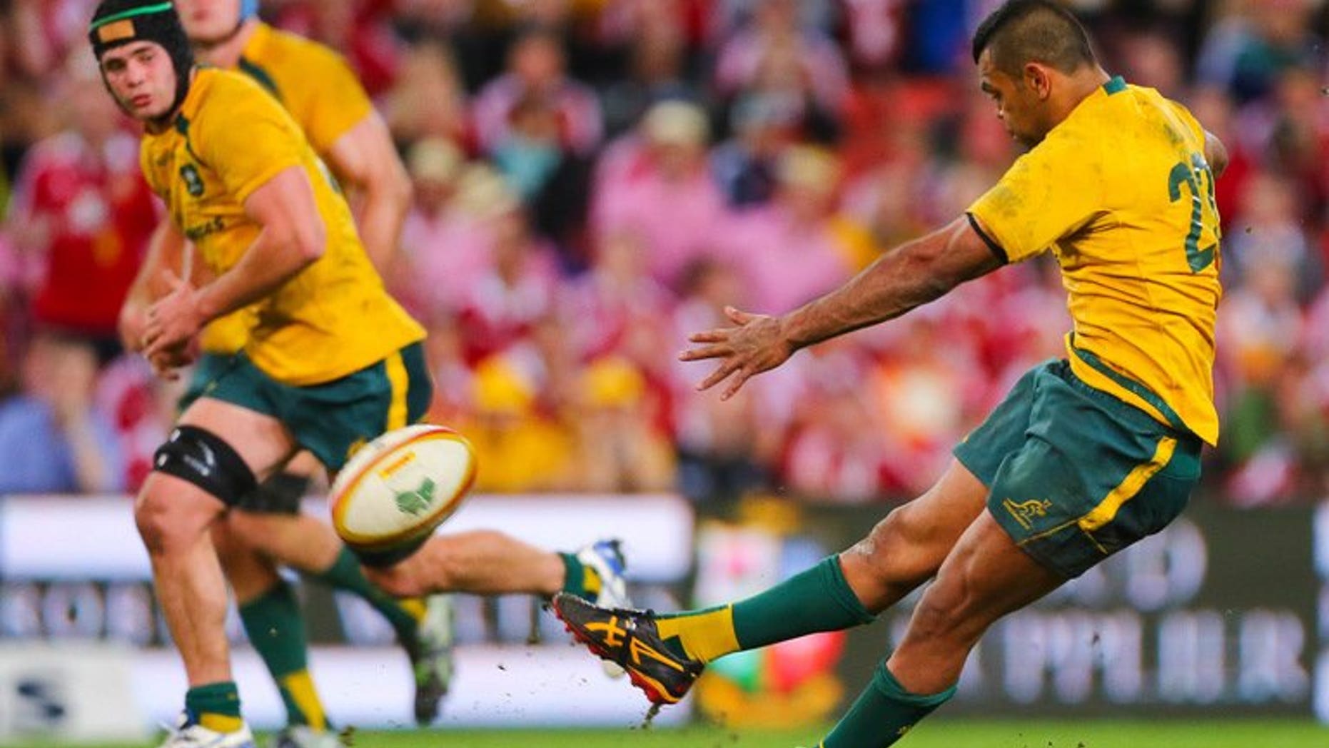 Australia's Kurtley Beale slips as he attempts a winning penalty against the British and Irish Lions on June 22, 2013. Lions coach Warren Gatland has taken a swipe at the battered Wallabies ahead of this week's potentially decisive Melbourne Test by hinting a lack of professionalism by Beale cost Australia victory in Brisbane.
