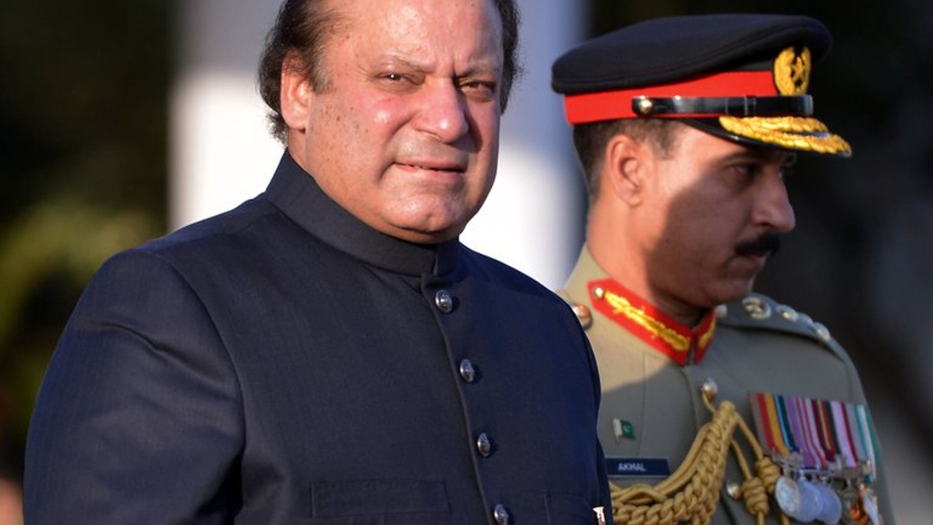 Pakistan's Prime Minister, Nawaz Sharif, arrives to inspect a guard of honour in Islamabad, on June 5, 2013. Sharif called on Monday for former military ruler Pervez Musharraf, who is currently under house arrest, to face trial for treason.