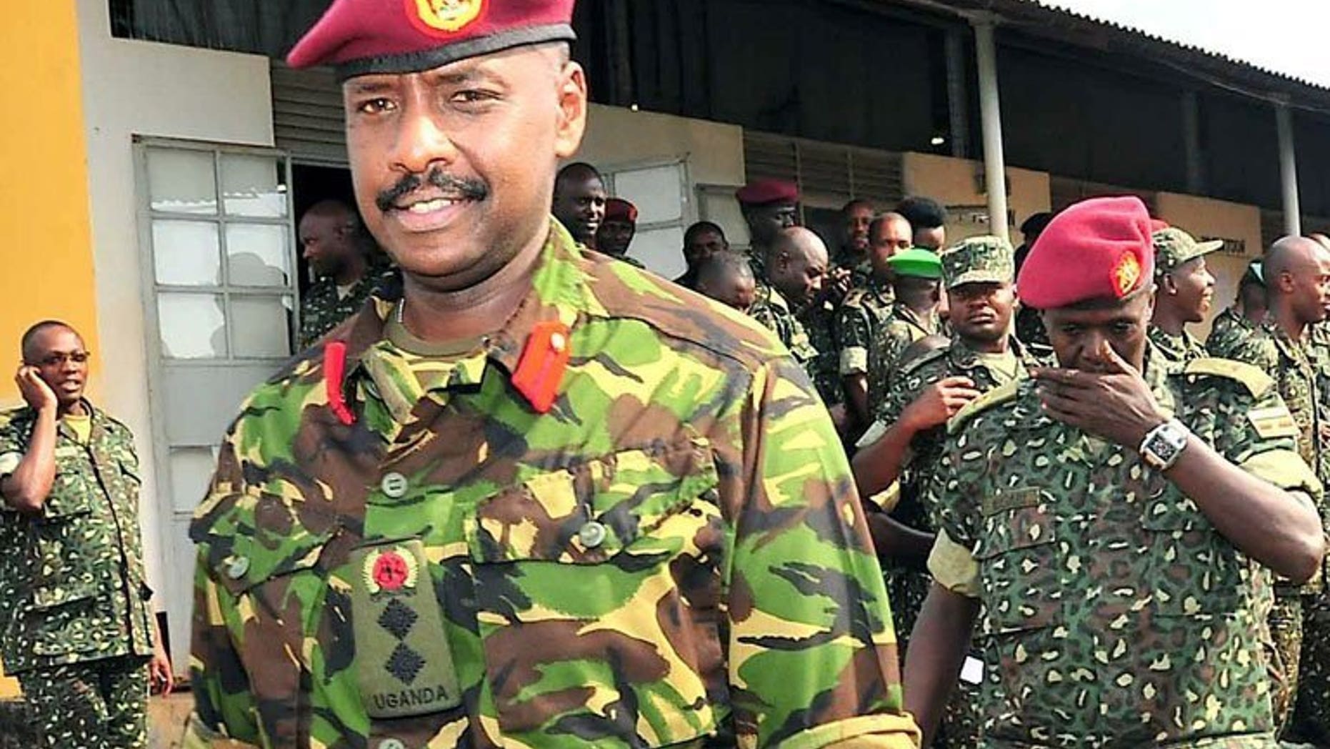 Brigadier Muhoozi Kainerugaba (L), son of Ugandan President Yoweri Museveni and commander of the Ugandan Special Forces Command, at the Sera Kasenyi training centre for Special Forces in Kampala on August 16, 2012. Kainerugaba has said he has no current plan to succeed his father, refuting weeks of opposition accusations he was preparing to take over power.