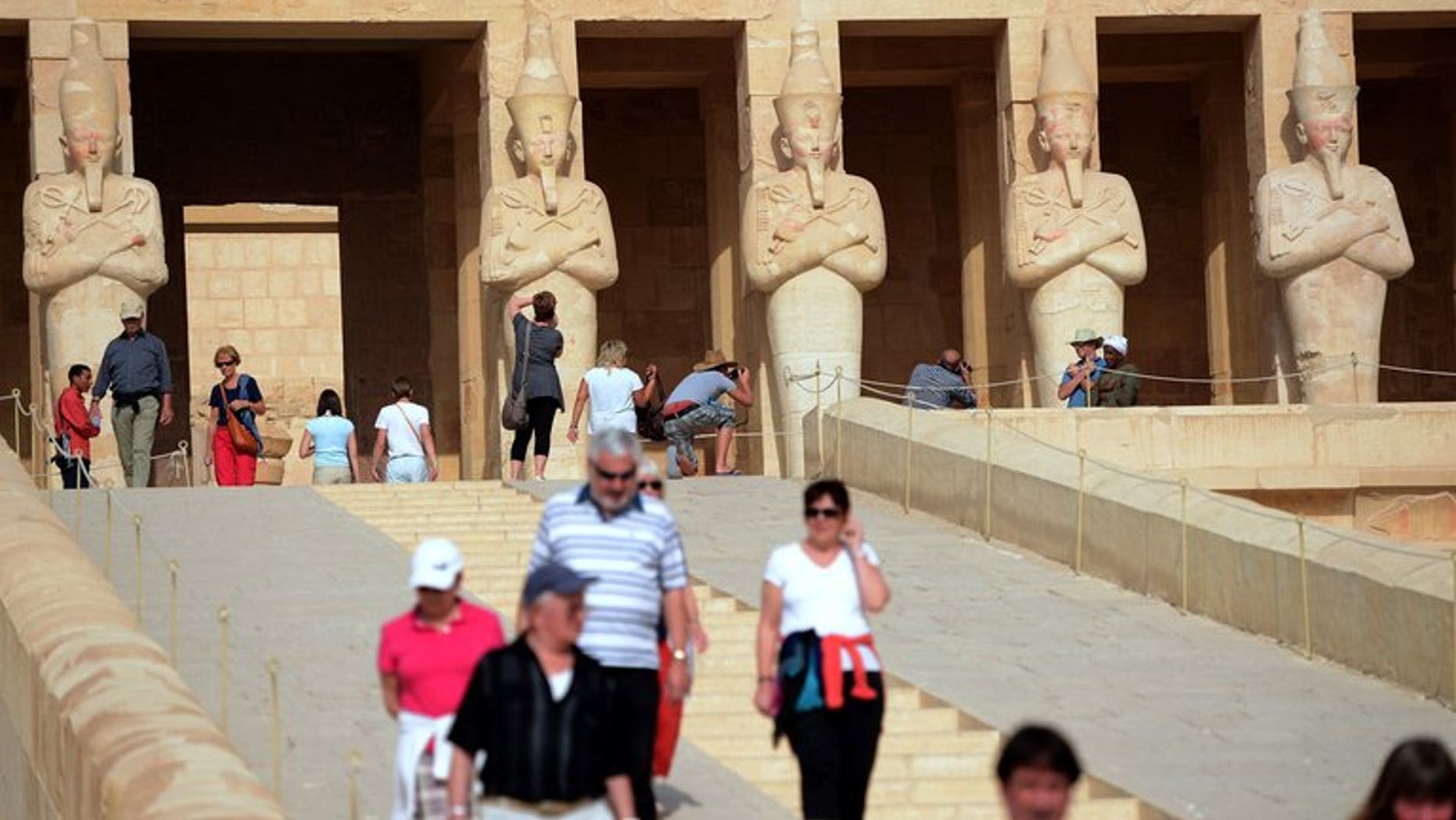 Tourists visit the Temple of Hatshepsut on February 27, 2013, in Egypt's ancient temple city of Luxor. Egypt's Tourism Minister Hesham Zazou was back at work on Monday after the newly appointed Islamist governor of Luxor quit following an outcry over his appointment to the post.