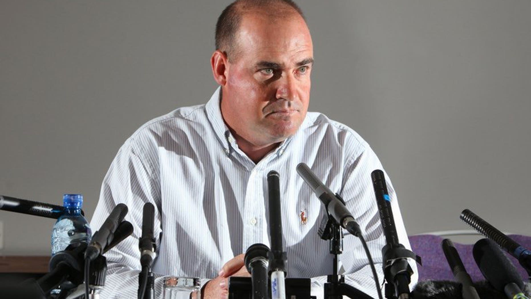 Sacked Australian cricket coach Mickey Arthur speaks to journalists during a press conference in Bristol, southwest England, on June 24, 2013. Arthur refused to blame the players after he was sacked as Australia's head coach just 16 days before the start of the Ashes series in England.