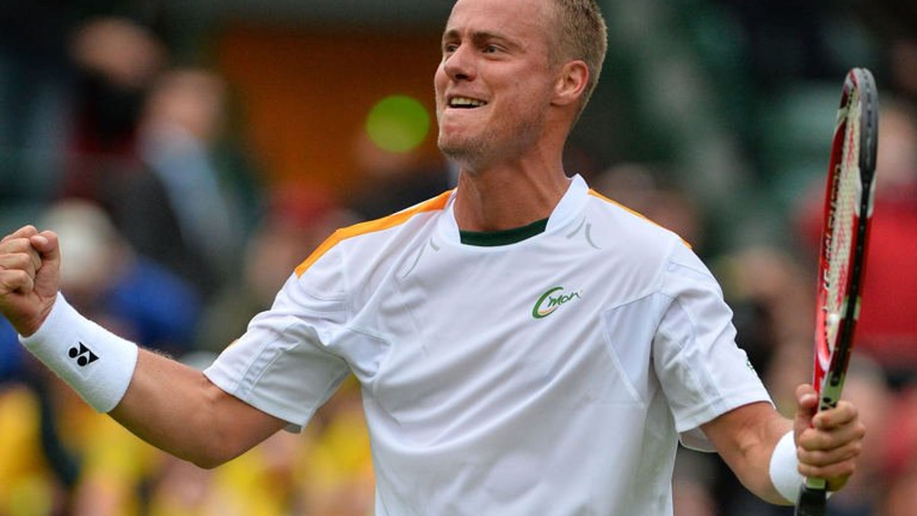 Australia's Lleyton Hewitt celebrates a win on day one of the 2013 Wimbledon Championships at the All England Club in London, on June 24, 2013. Seven surgeons told Hewitt his tennis career was finished if he had on operation on his troublesome toe but the gritty Australian is merrily defying them by battling on and making himself a force to be reckoned with once again.