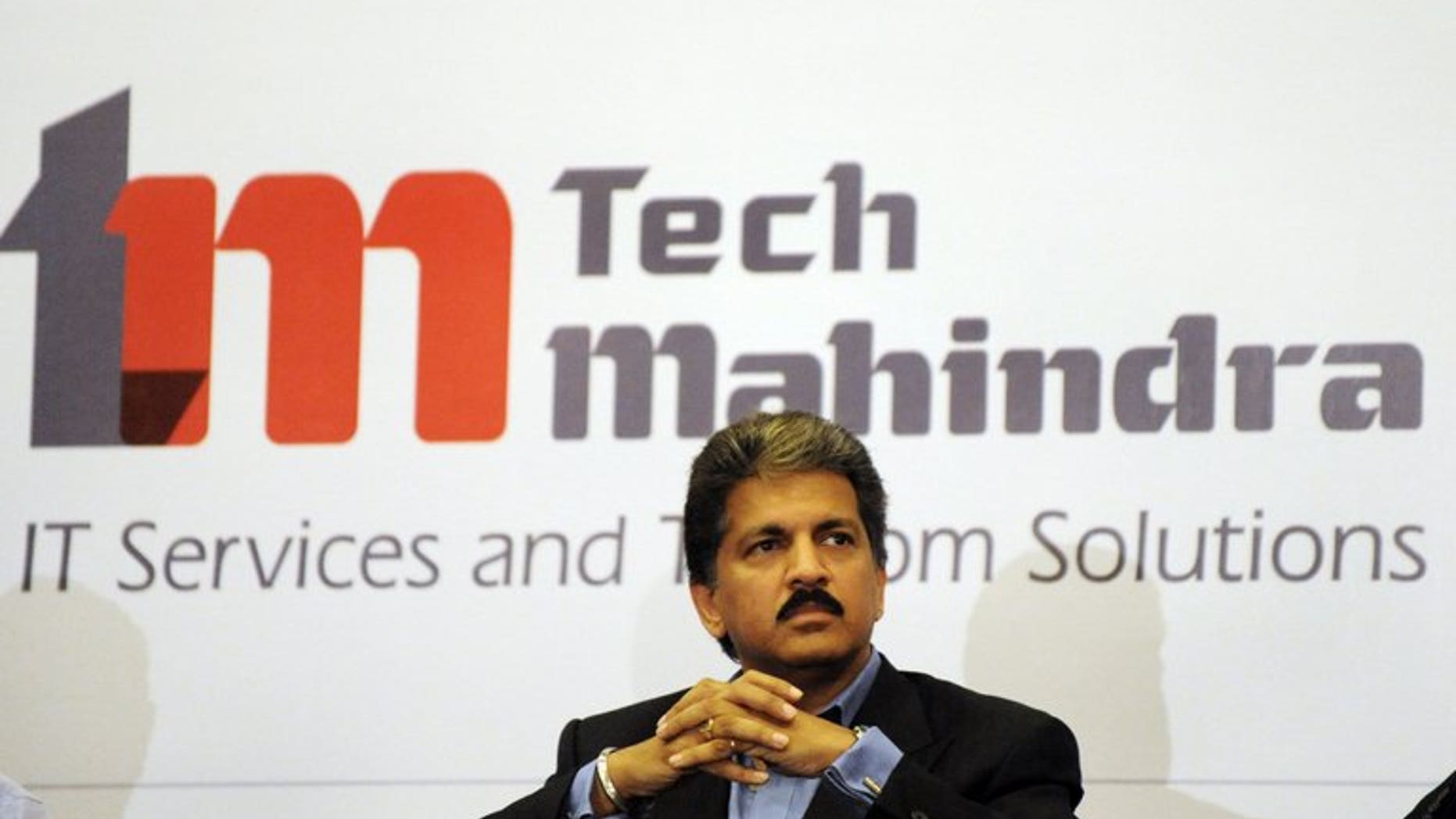 Anand Mahindra listens to a question during a press conference in Hyderabad on April 20, 2009. Indian IT outsourcer Tech Mahindra on Tuesday completed a takeover of its partly-owned unit Mahindra Satyam, creating a new force in the sector with annual revenues of $2.7 billion.