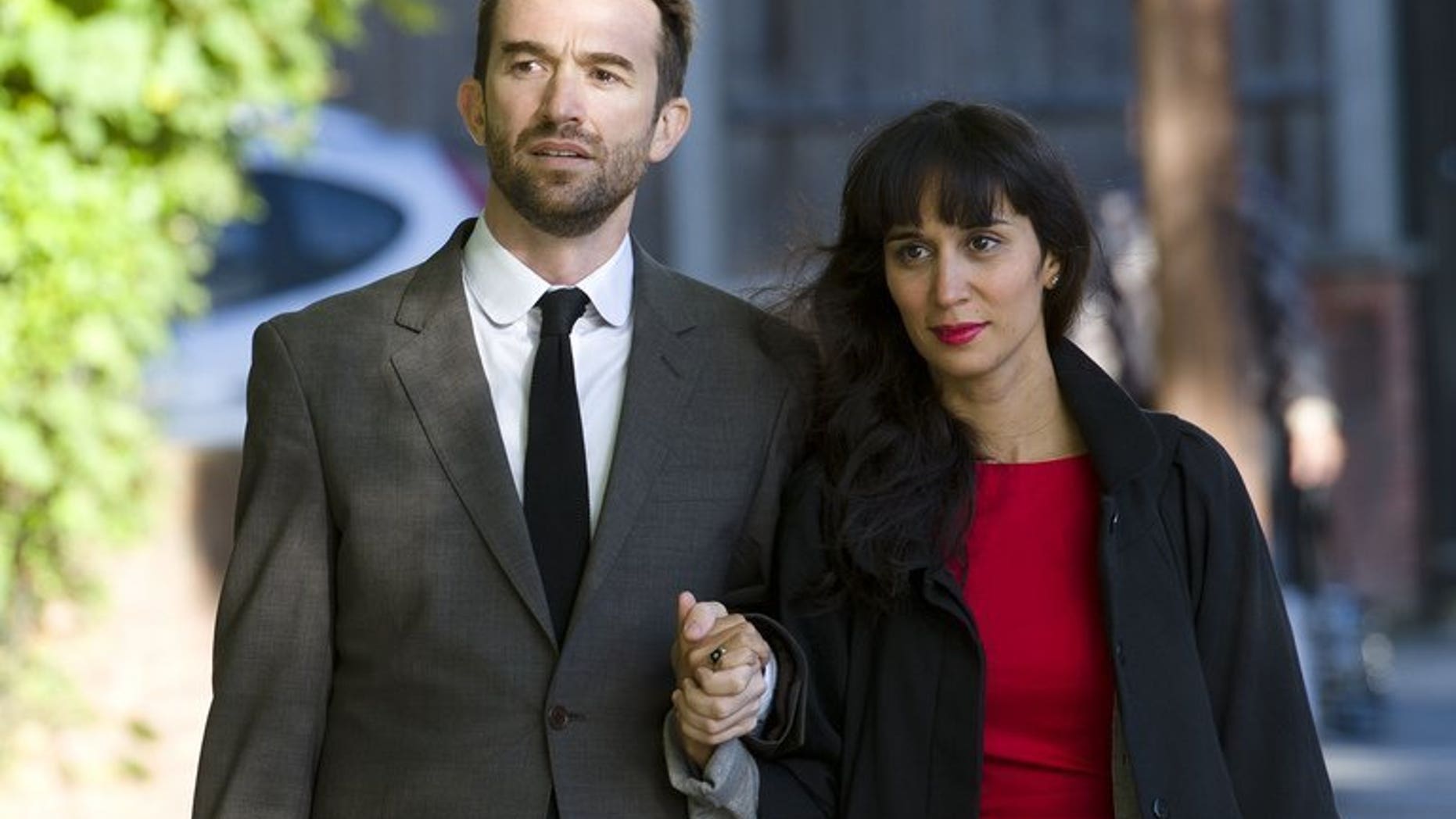Australian Trenton Oldfield (L) and his wife Deepa Naik arrive at Isleworth Crown Court in west London on September 25, 2012 during his trial. Oldfield, who was jailed for disrupting Britain's annual university Boat Race on April 7 2012, has been told to leave the country despite the fact his British wife is pregnant, officials said Tuesday.