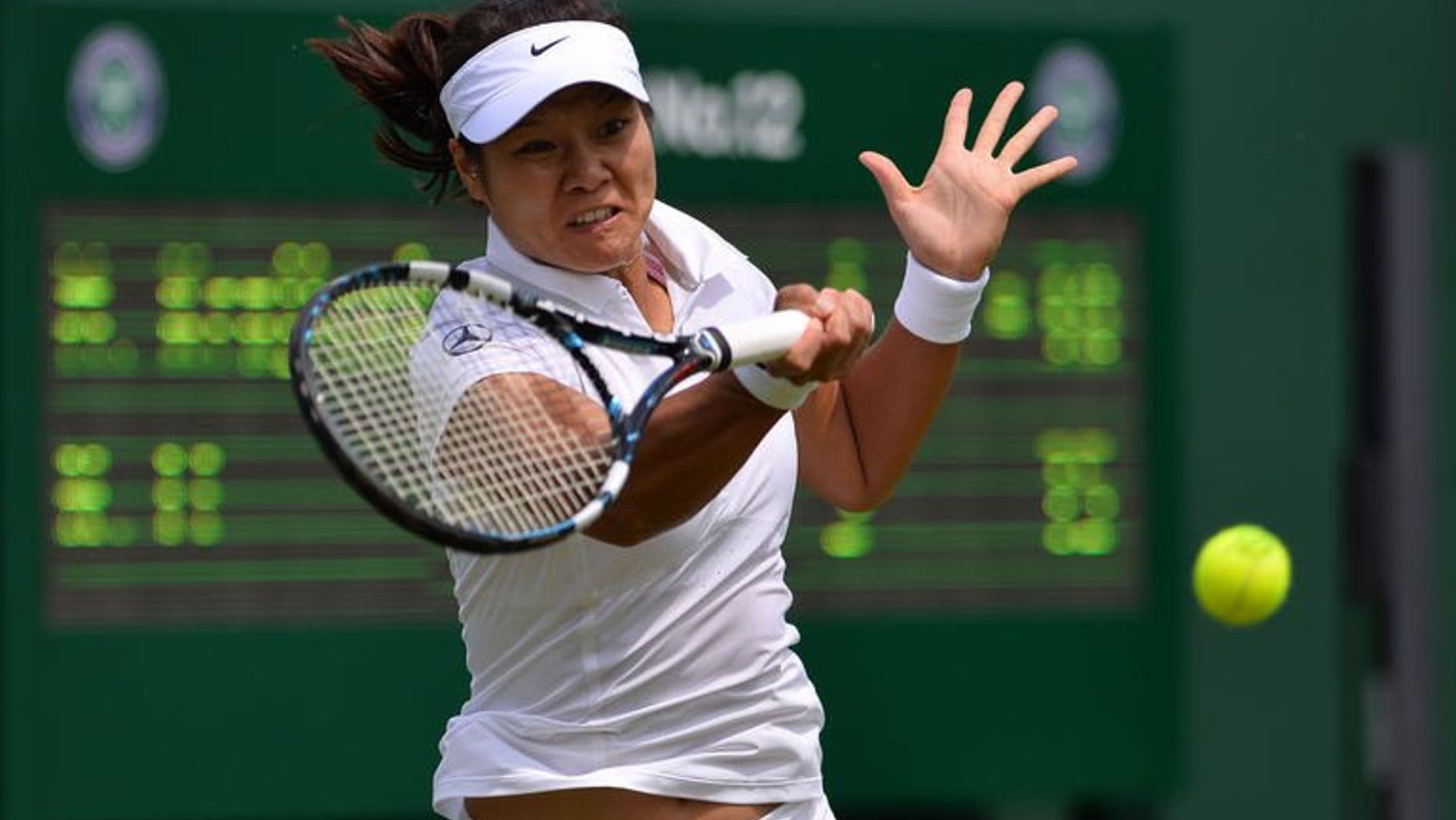 China's Li Na returns against Michaella Krajicek during their women's first round match on day two of the 2013 Wimbledon Championships tennis tournament at the All England Club in Wimbledon, southwest London, on June 25, 2013. Li won 6-1, 6-1.