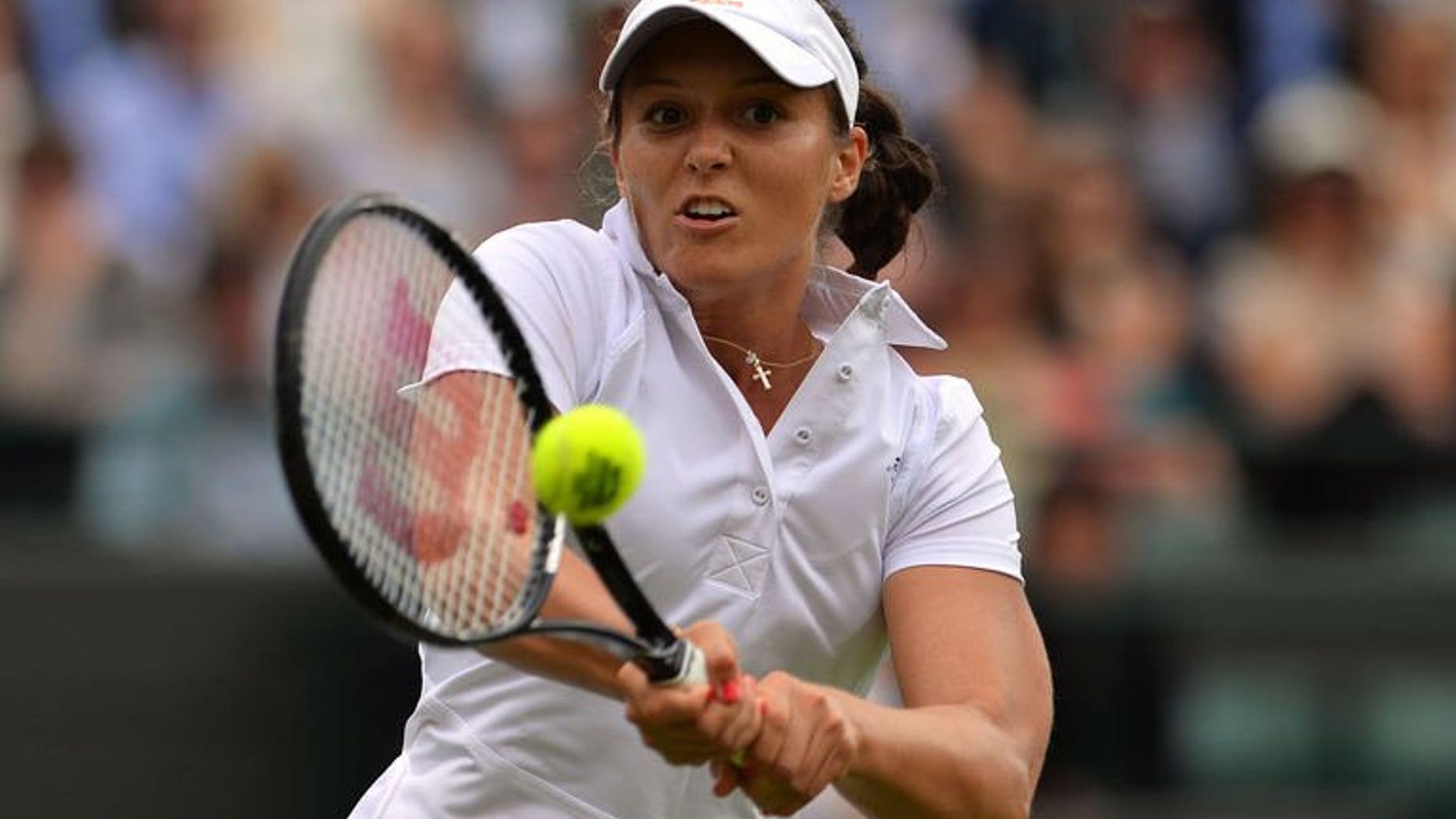 Britain's Laura Robson returns on her way to beating Russia's Maria Kirilenko during their women's first round match on day two of the 2013 Wimbledon Championships tennis tournament at the All England Club in Wimbledon, southwest London, on June 25, 2013. Robson won 6-3, 6-4.