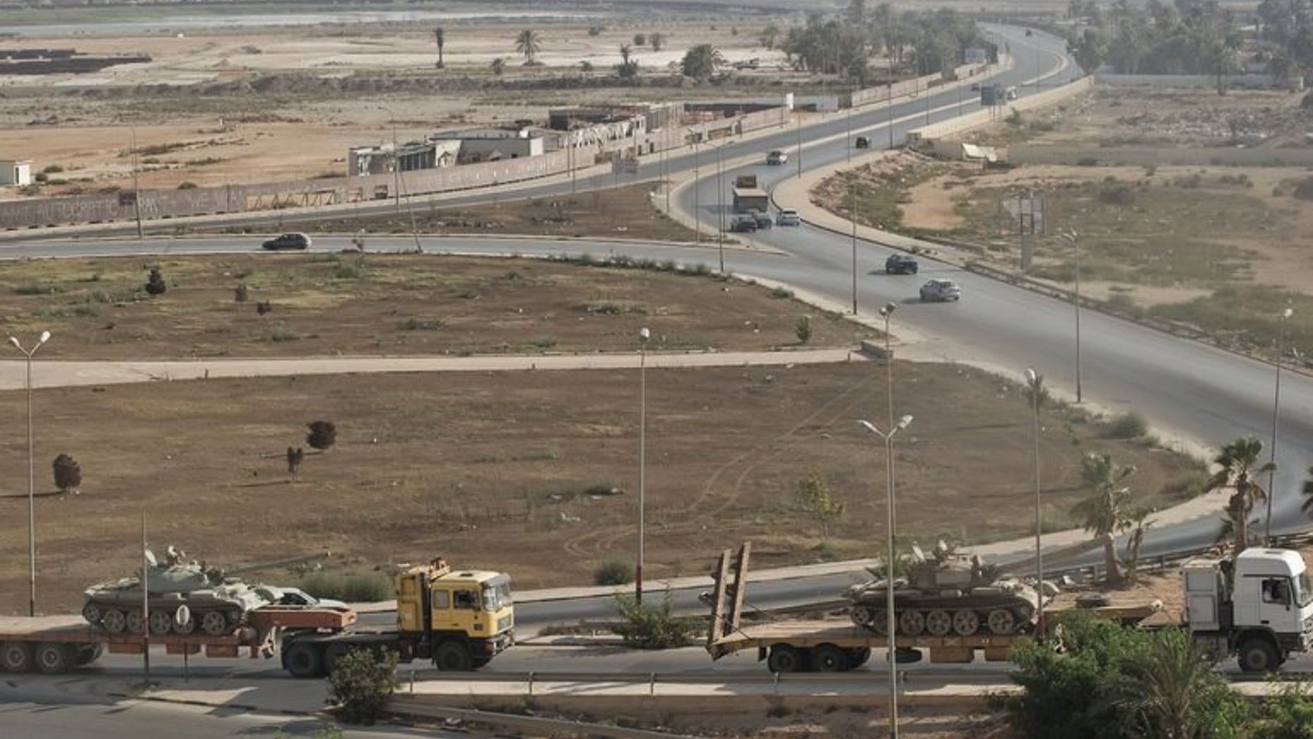 Russian-made tanks are transported towards the Giulian Harbour in Benghazi on August 25, 2011, during Libya's Arab Spring. Libya has become a major transit hub for terrorists, an African Union leader warned on Tuesday on the sidelines of a regional security meeting in neighbouring Algeria.