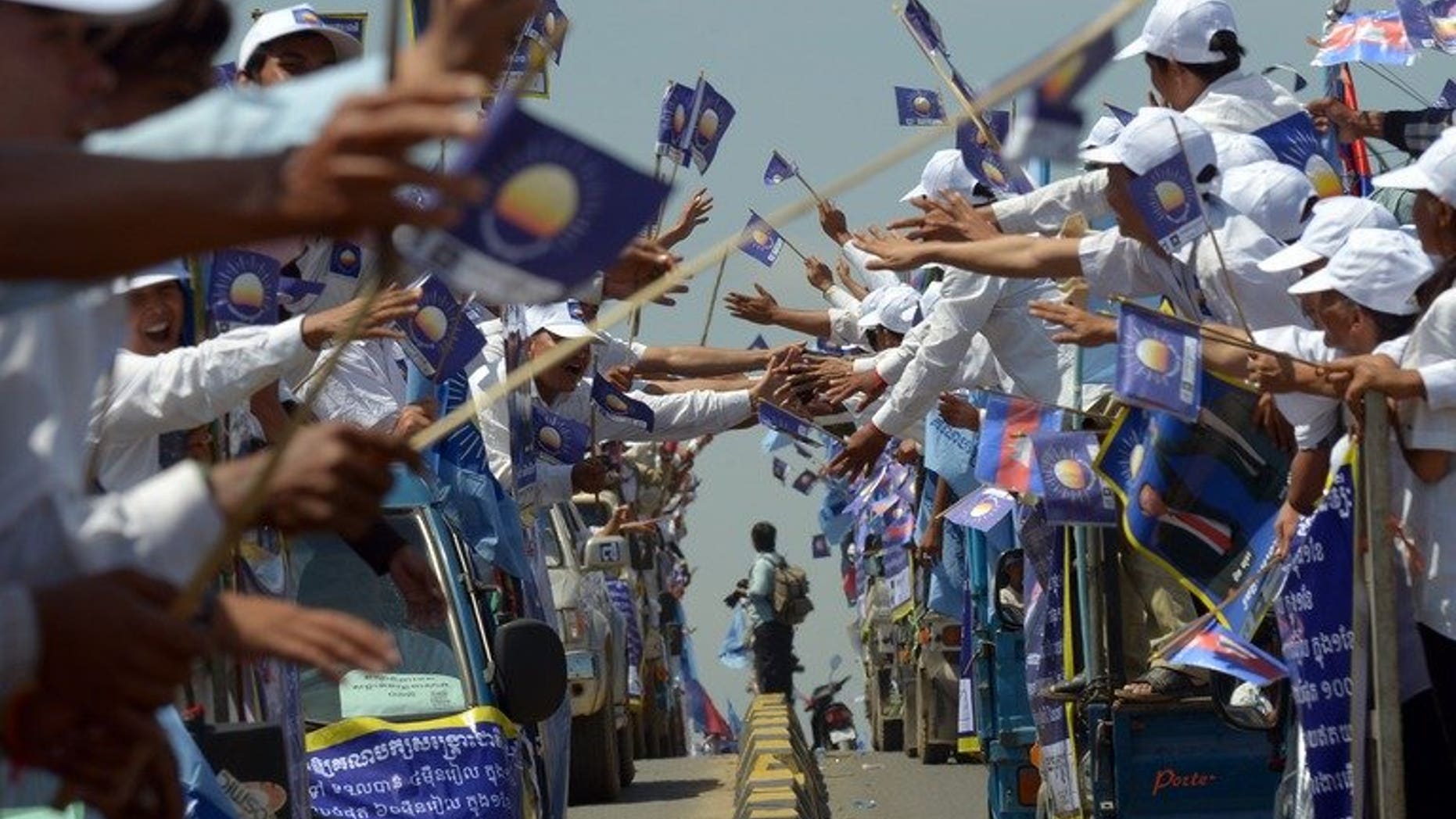 Cambodia National Rescue Party supporters out in force in the run-up to the general election, in Phnom Penh, on June 27, 2013. Cambodia denied it had banned foreign radio broadcasts in the lead-up to next month's election, after the US accused the government of violating freedom of expression.