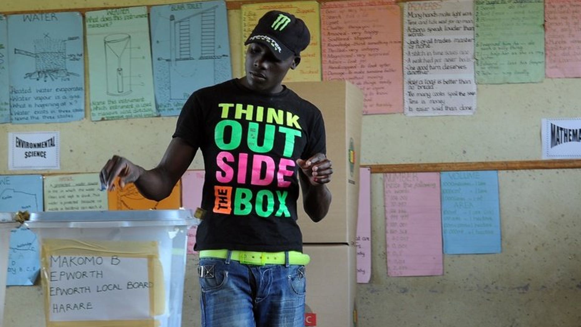 A Zimbabwean casts his vote in Epwath on March 16, 2013 during a referendum on a new constitution that would curb President Robert Mugabe's powers and pave the way for elections later in the year. US President Barack Obama has called for Zimbabwe's government to cease harassment and implement reforms ahead of landmark elections expected later this year.