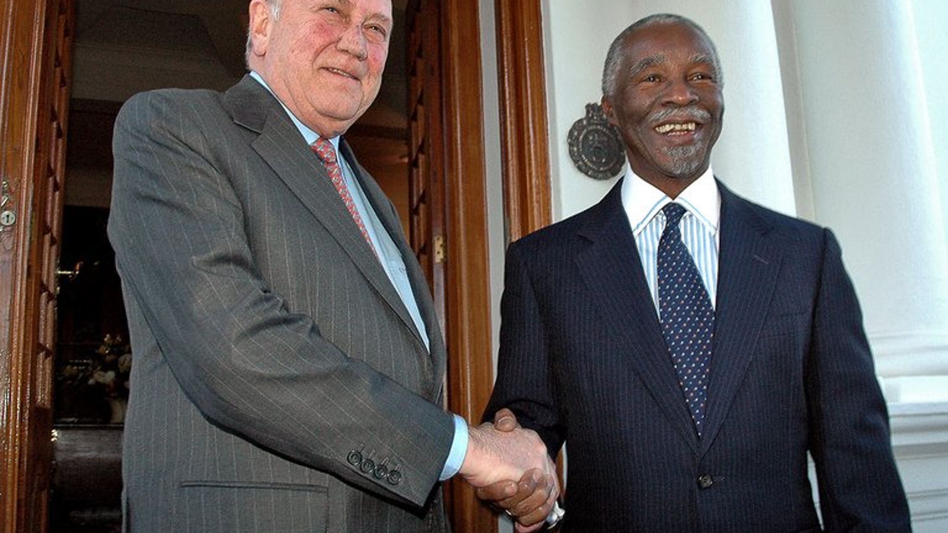 Former South African President FW De Klerk (left) is pictured with then president Thabo Mbeki in Pretoria on 22 May 2007. De Klerk will cut short a visit to Europe because of the ailing health of his co-Nobel prize winner Nelson Mandela, his foundation said.