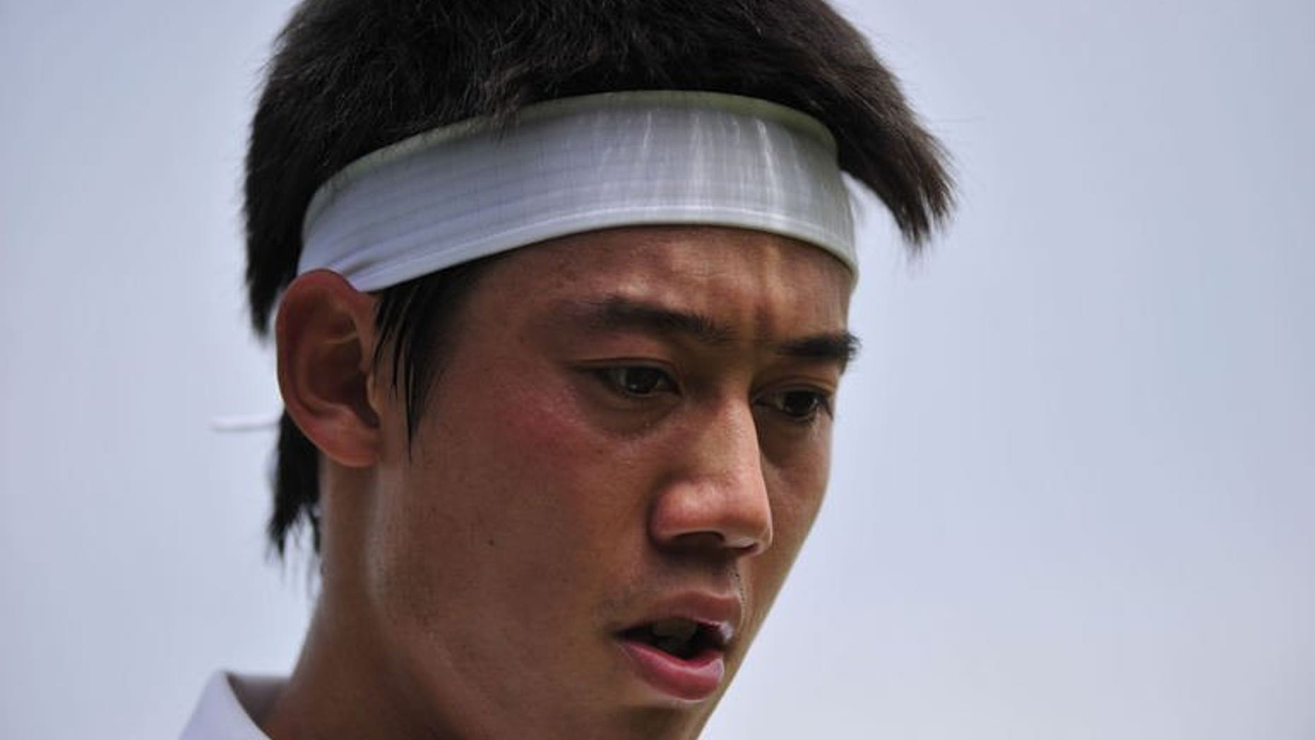 Japan's Kei Nishikori plays against Italy's Andreas Seppi in their third round match at Wimbledon on June 29, 2013. Nishikori has vowed to bounce back from his frustrating Wimbledon exit by turning on the style during the US hardcourt season.