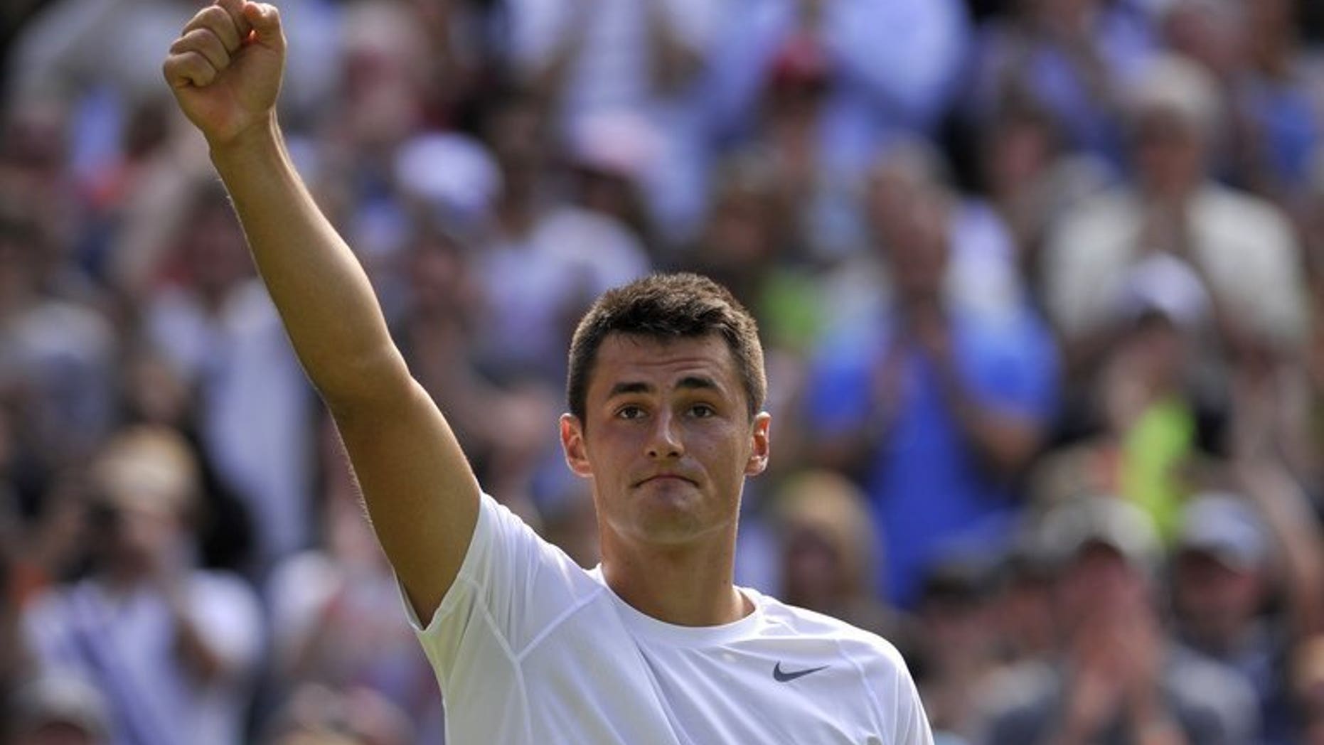 Australia's Bernard Tomic celebrates a match victory in Wimbledon, London, on June 29, 2013. Tomic is facing a fourth round clash with Czech seventh seed Tomas Berdych on Monday and thinks his dad's training can give the 2010 Wimbledon runner-up plenty to think about.
