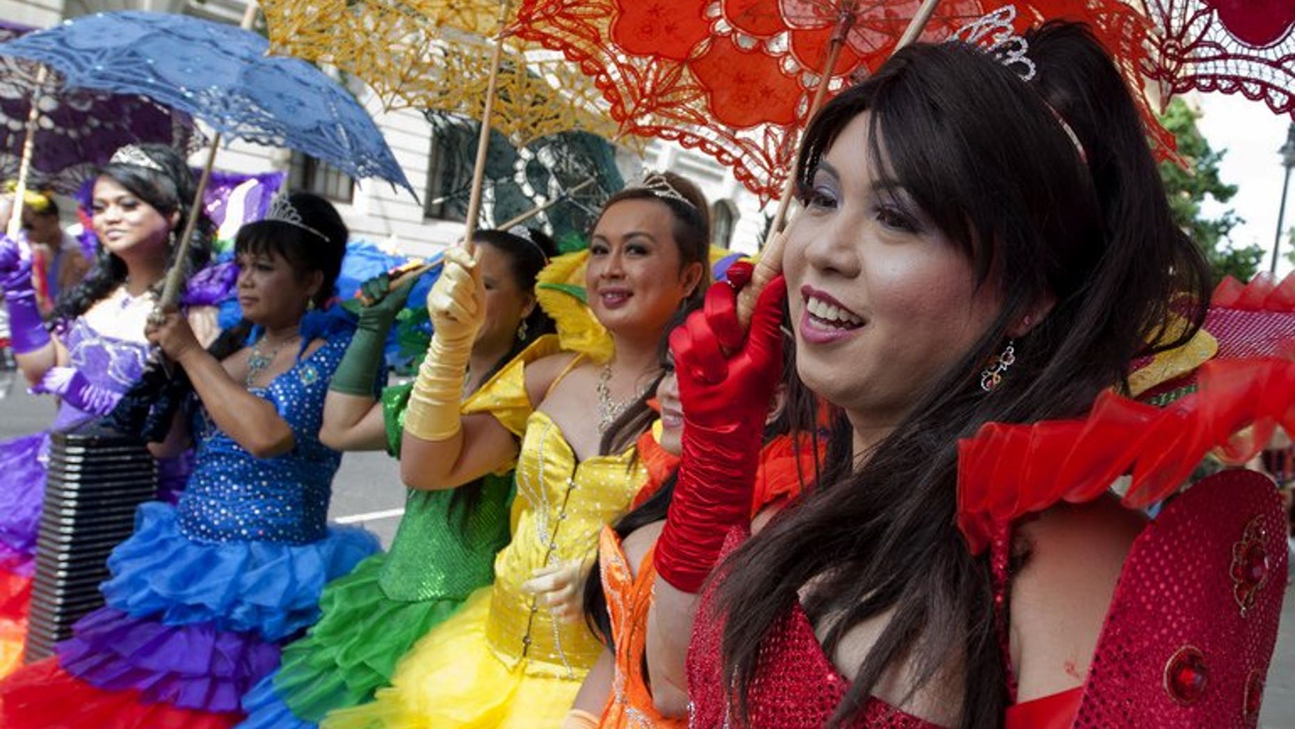 Members of the Lesbian, Gay, Bisexual and Transgender (LGBT) community parade in central London on June 29, 2013. Thousands of people marched, celebrating the theme of "love and marriage" as parliament prepares to consider a bill to allow same-sex weddings.
