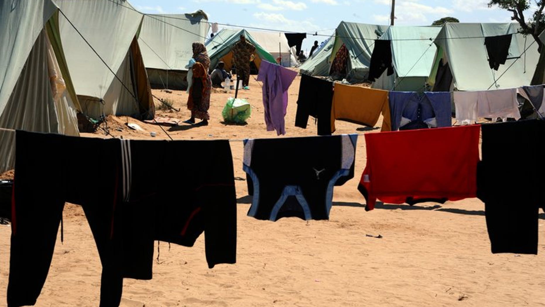 A refugee who fled Libya walks at the Tunisian refugee camp of Choucha on March 18, 2011 in Ras Jdir. Several hundred people who had fled the 2011 Libya conflict have refused to leave the camp in southern Tunisia, which was due to be shut, blocking attempts to dismantle their tents, an AFP journalist reported.