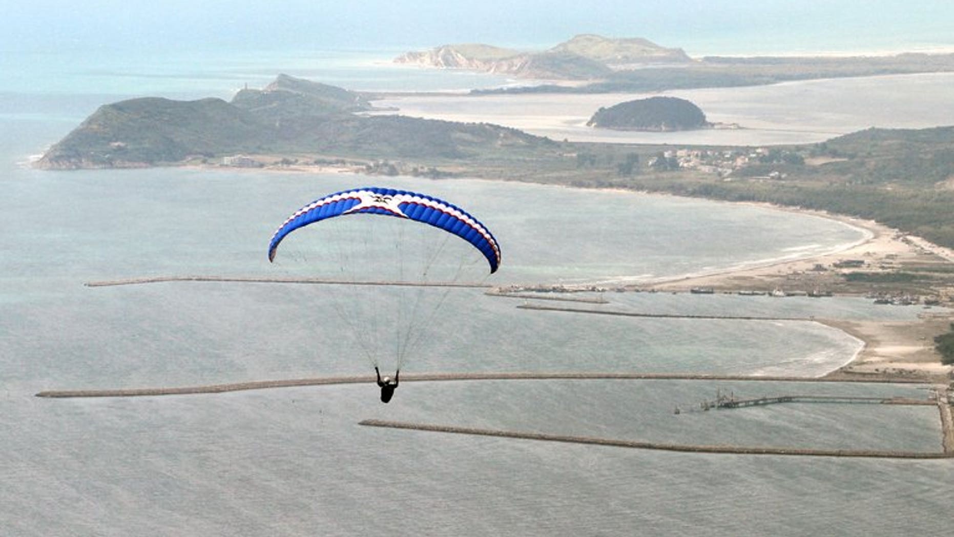 A paraglider flies over the shores of Albanian coastal town of Vlora. Iran on Sunday confirmed the arrest of several Slovaks two days after Bratislava announced that a group of paragliders had been apprehended, reportedly accused of espionage.