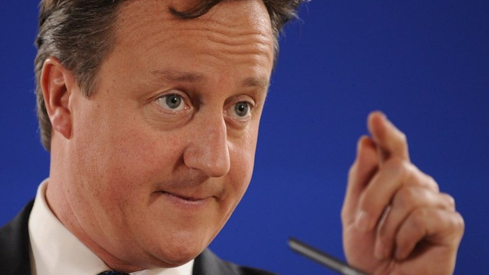 British Prime Minister David Cameron attends a news conference in Brussels on June 28, 2013. Cameron arrived in Kazakhstan on the first ever trip by a serving British prime minister, hoping to boost trade ties but also promising to raise human rights concerns.