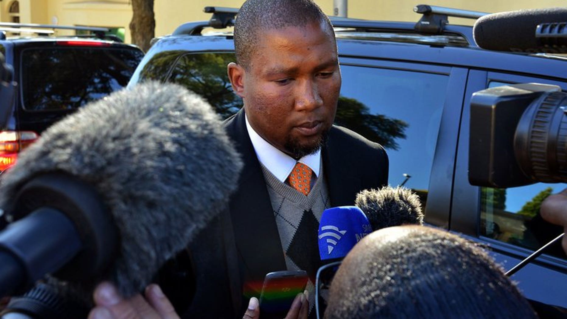 Mandla Mandela addresses the media in Johannesburg on June 12, 2013. A bitter feud within Nelson Mandela's family over the final resting place of the ailing anti-apartheid hero and his children intensified Sunday, with his grandson Mandla lamenting the dispute has been taken to court.
