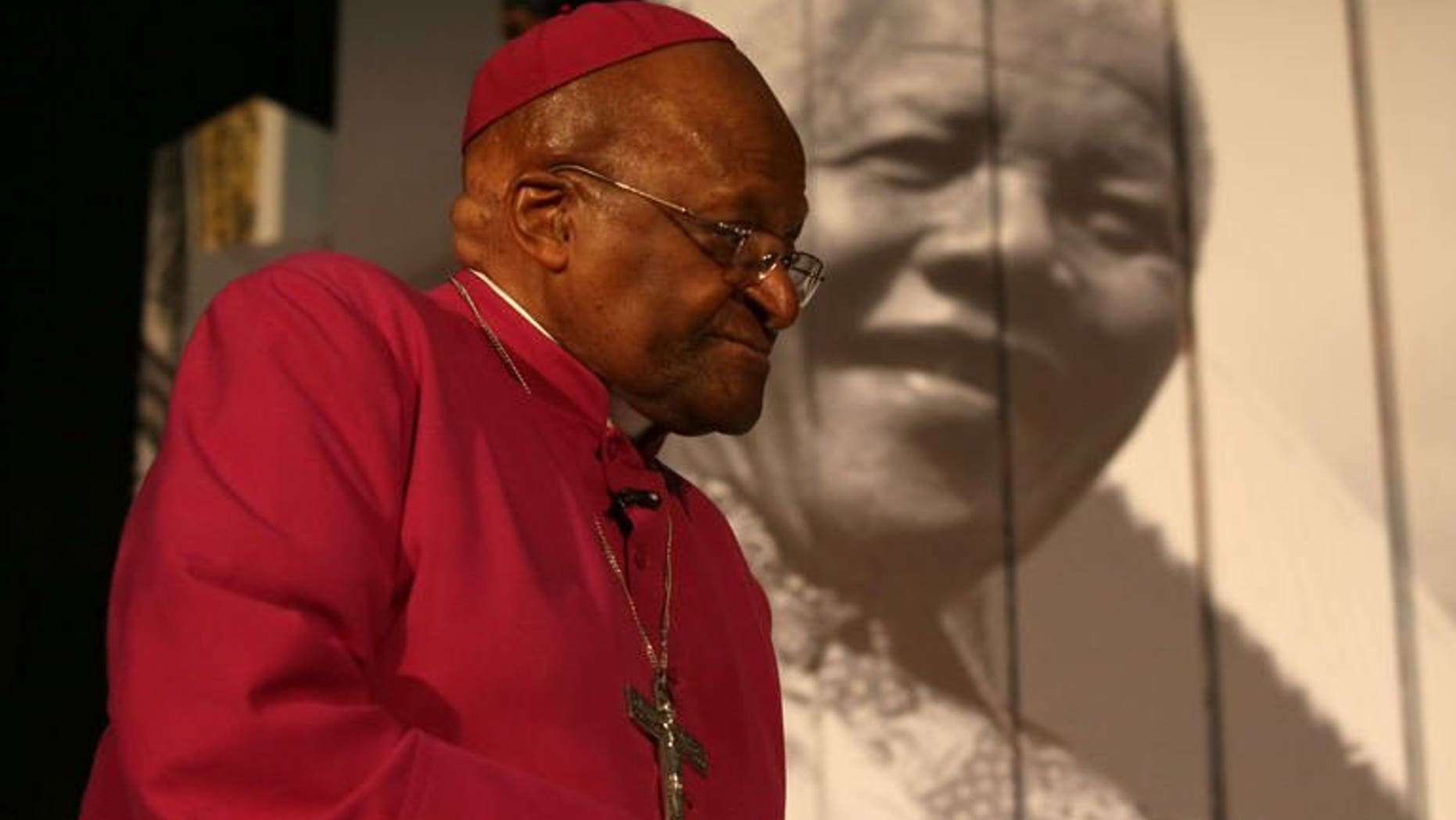 Archbishop Desmond Tutu attends the launch of Cape Town's Nelson Mandela Legacy Exhibition at the Civic Centre on June 30, 2013. Tutu on Sunday hailed Mandela as an "incredible, incredible person" who was still uniting South Africans from the hospital bed where he is battling for his life.