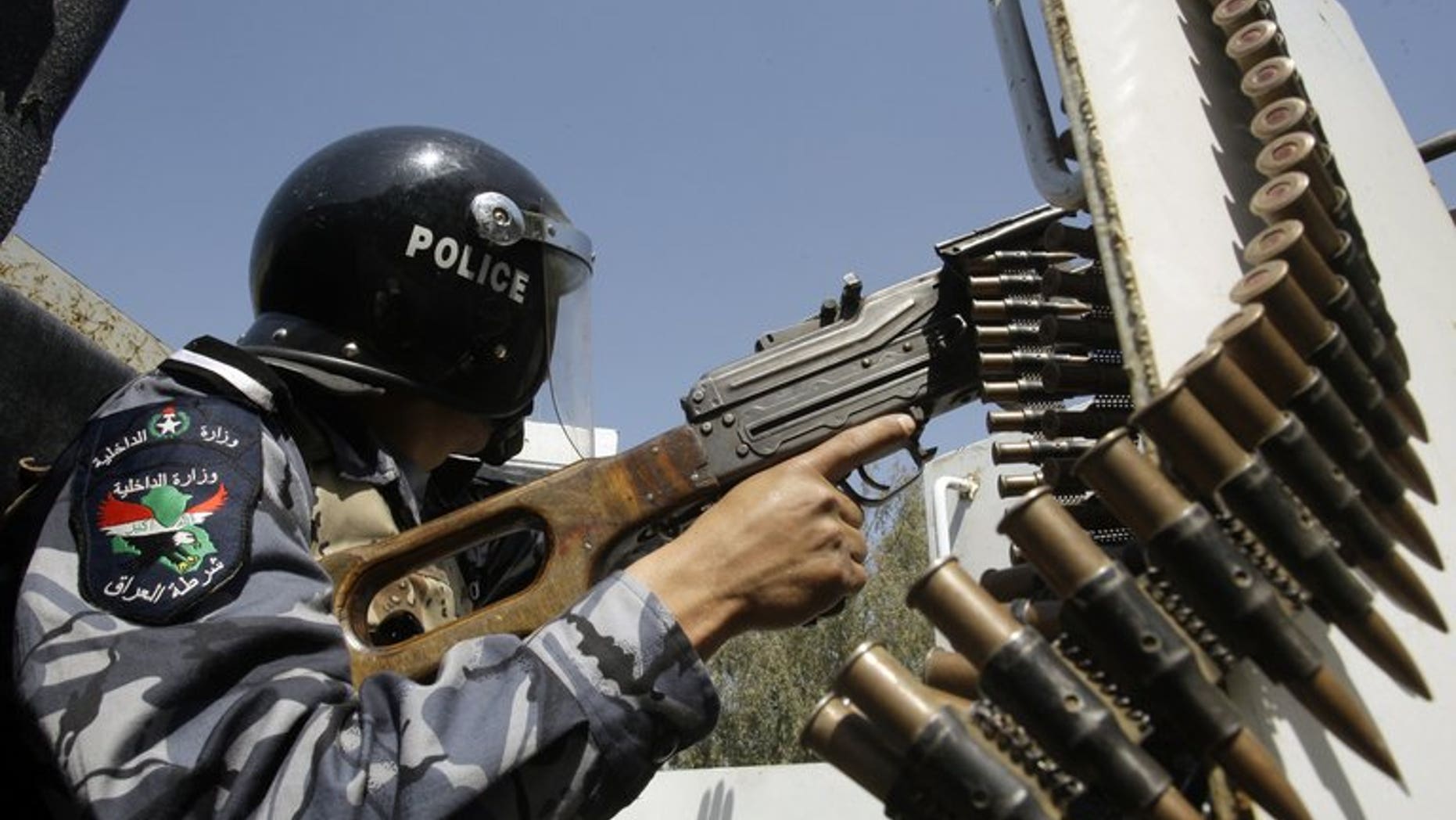 An Iraqi policeman patrols in the eastern Baghdad area of Nahrawan on March 30, 2011. A bombing at a Baghdad football pitch killed nine people Sunday, the majority of them young boys, officials said, the latest in a series of attacks targeting Iraqis playing and watching football.